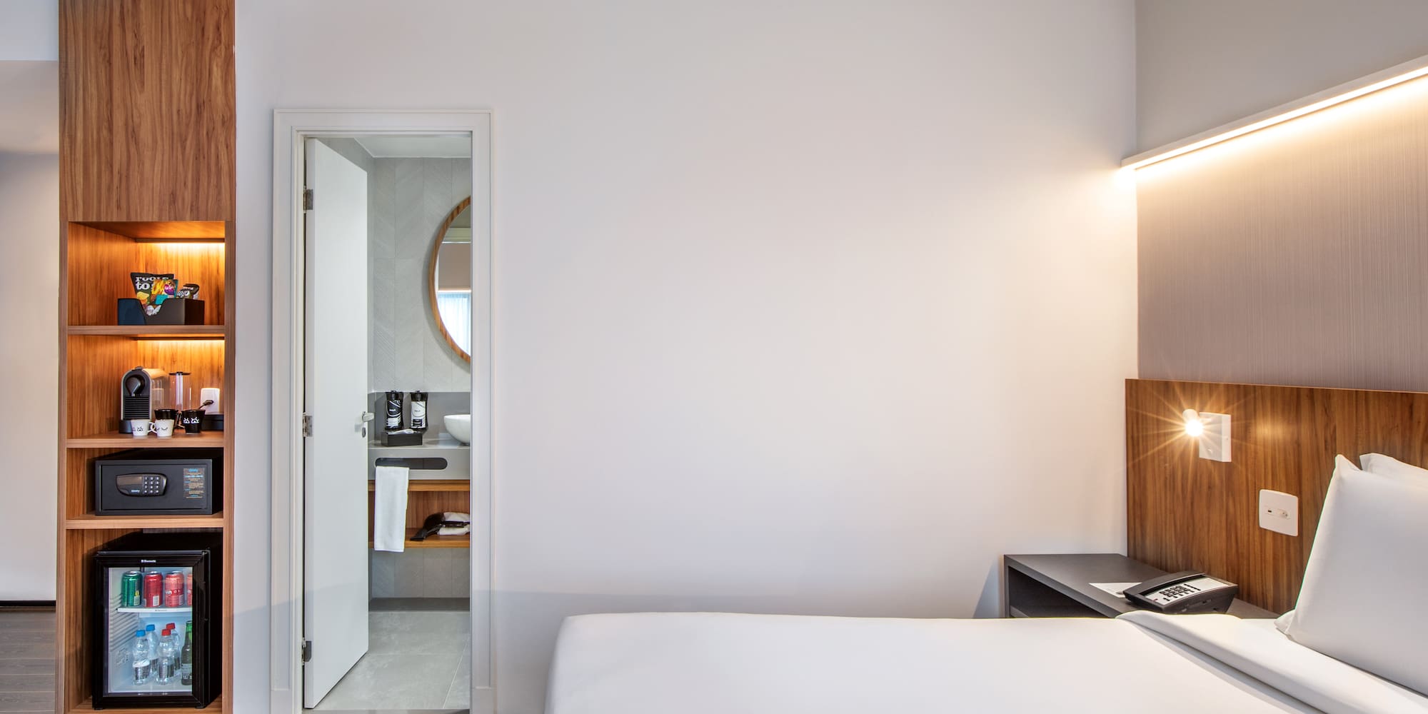 a bedroom with a bed and a desk