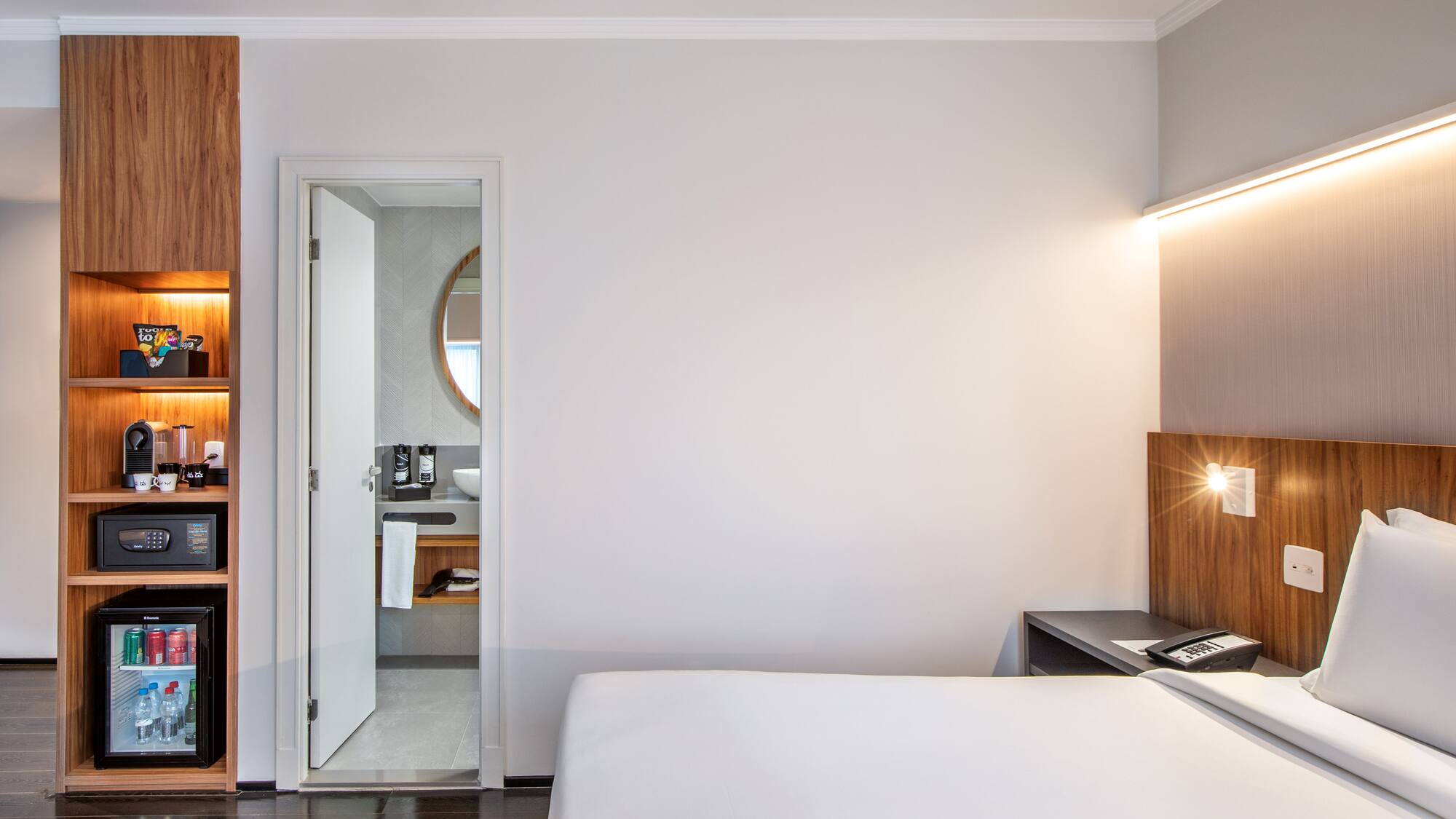 a bedroom with a bed and a desk