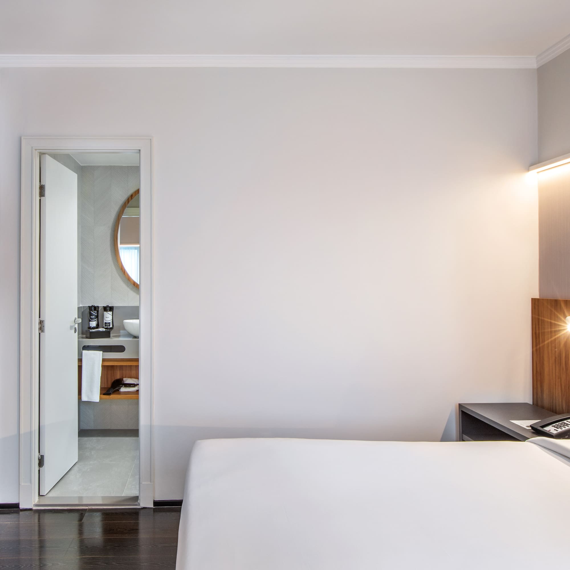 a bedroom with a bed and a desk