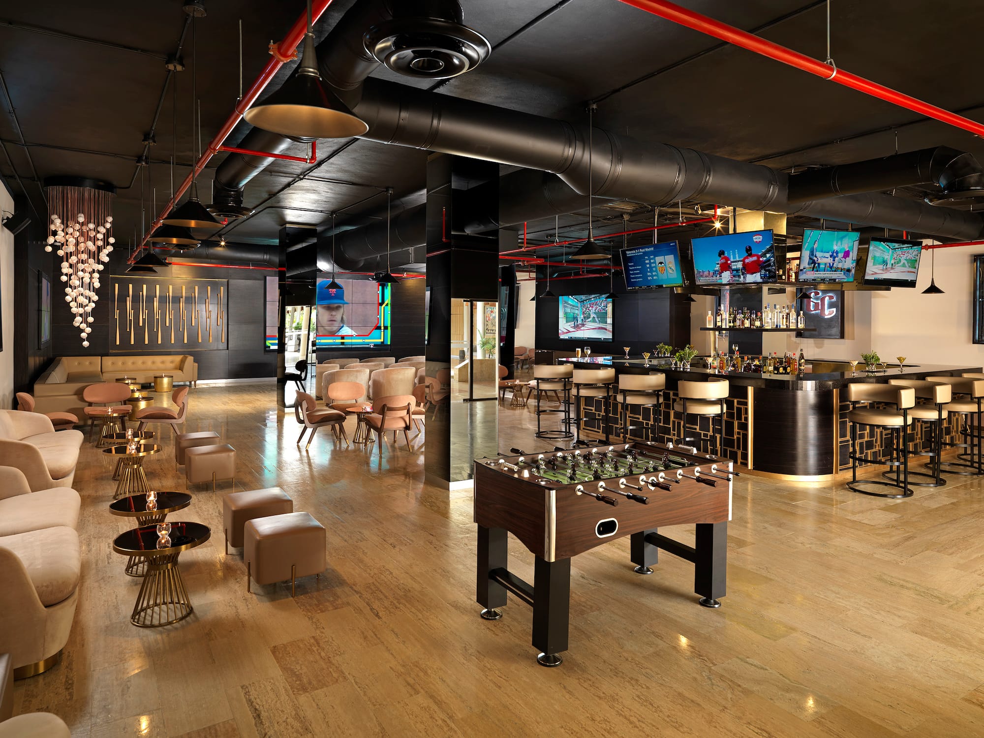 a room with a foosball table and chairs