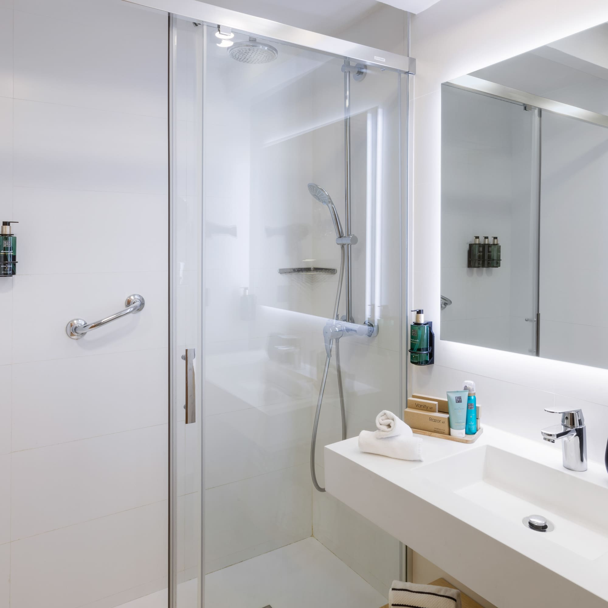 a bathroom with a glass shower door