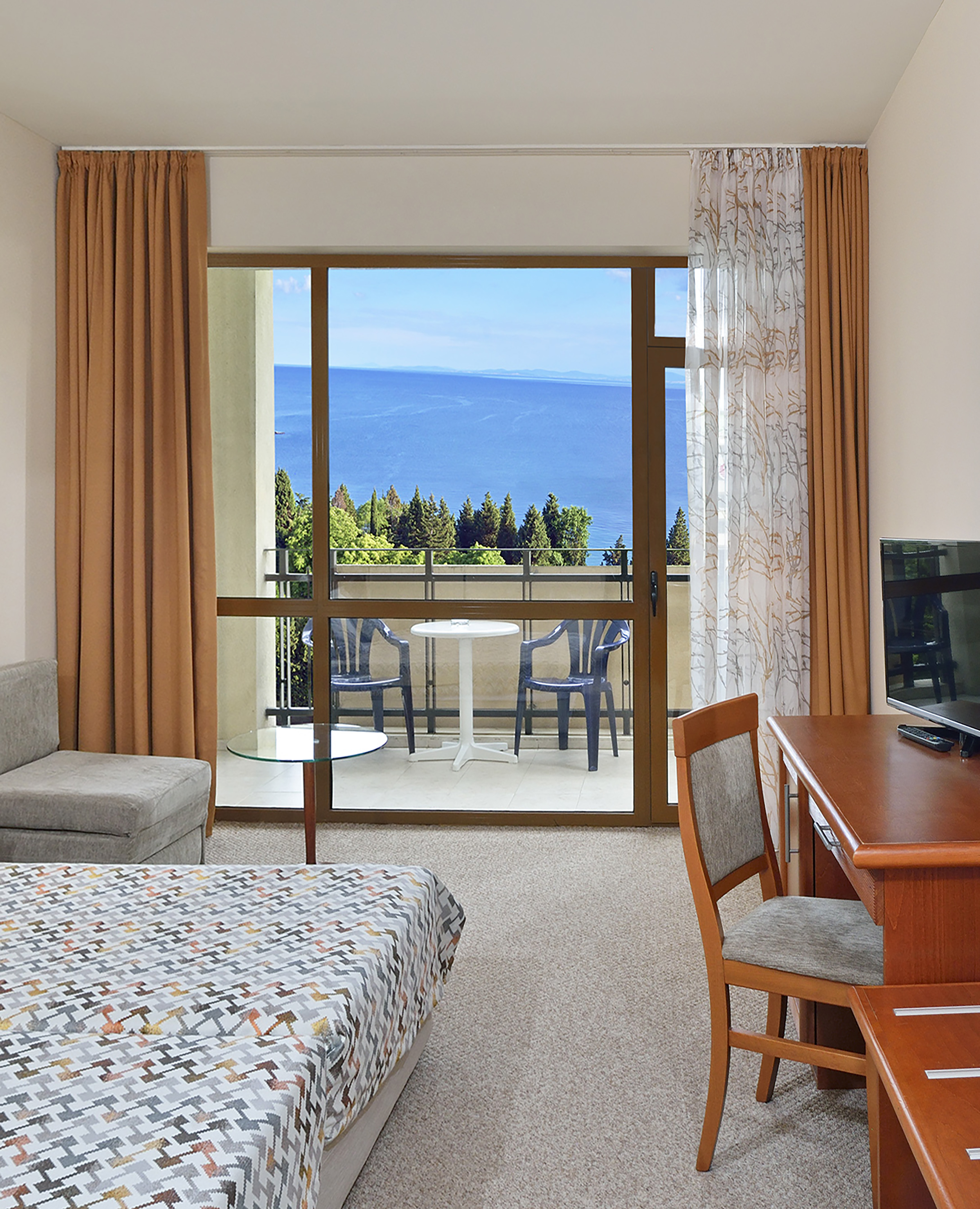 a room with a television and a table