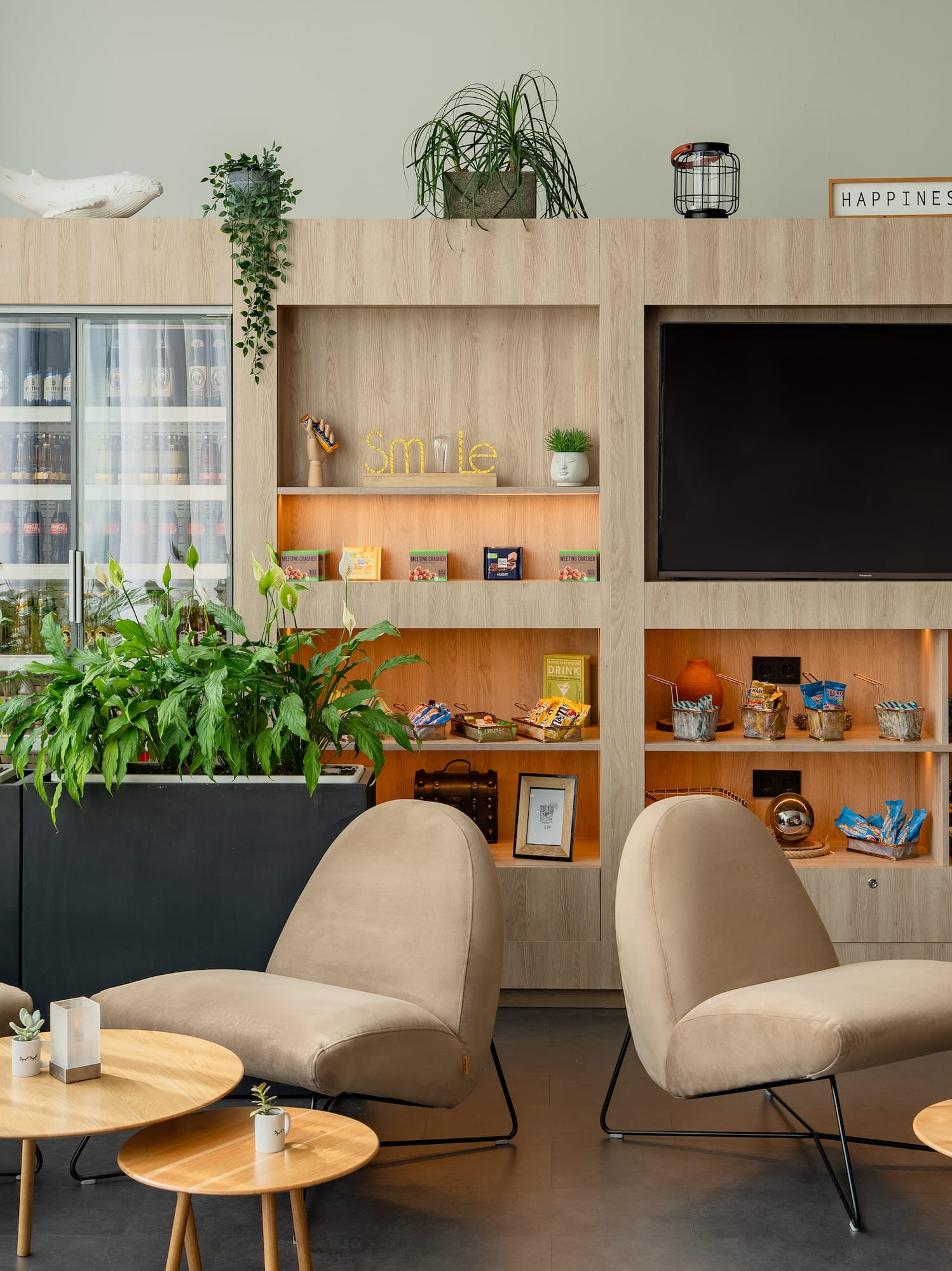 a room with a tv and chairs