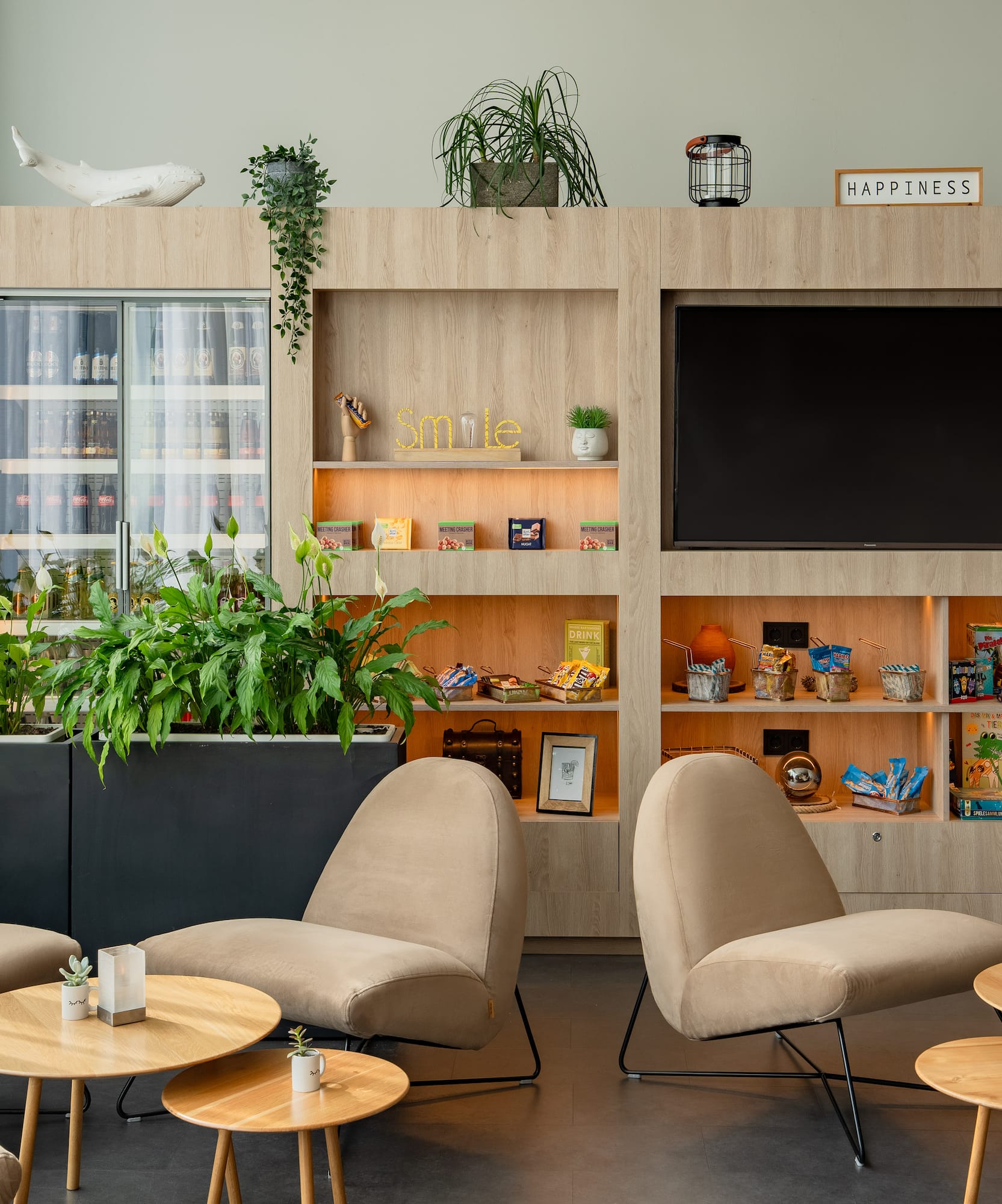 a room with a tv and chairs