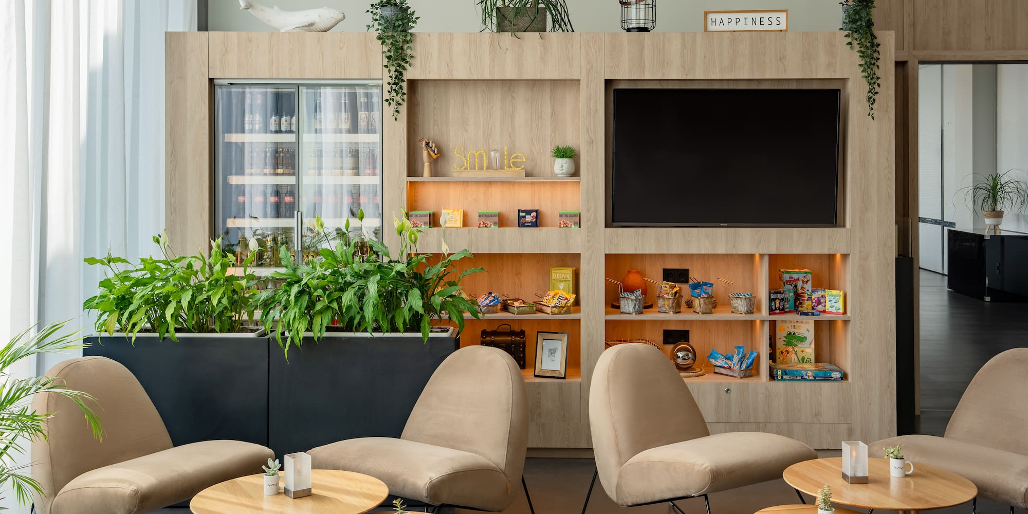 a room with a tv and chairs