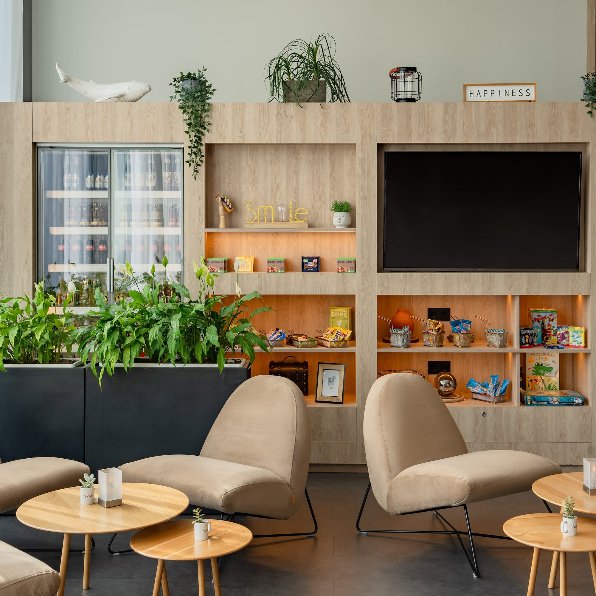 a room with a tv and chairs