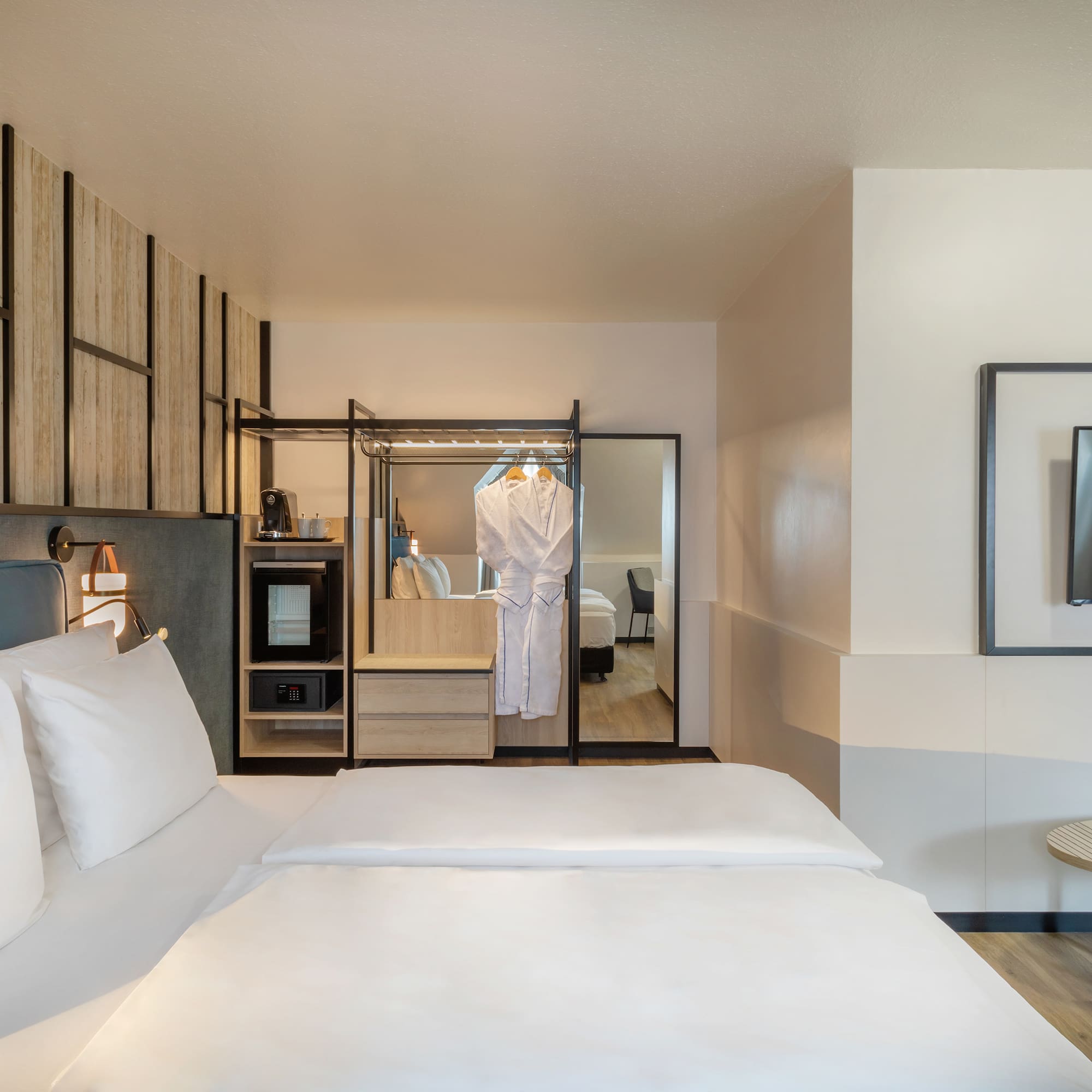 a room with a bed and a mirror