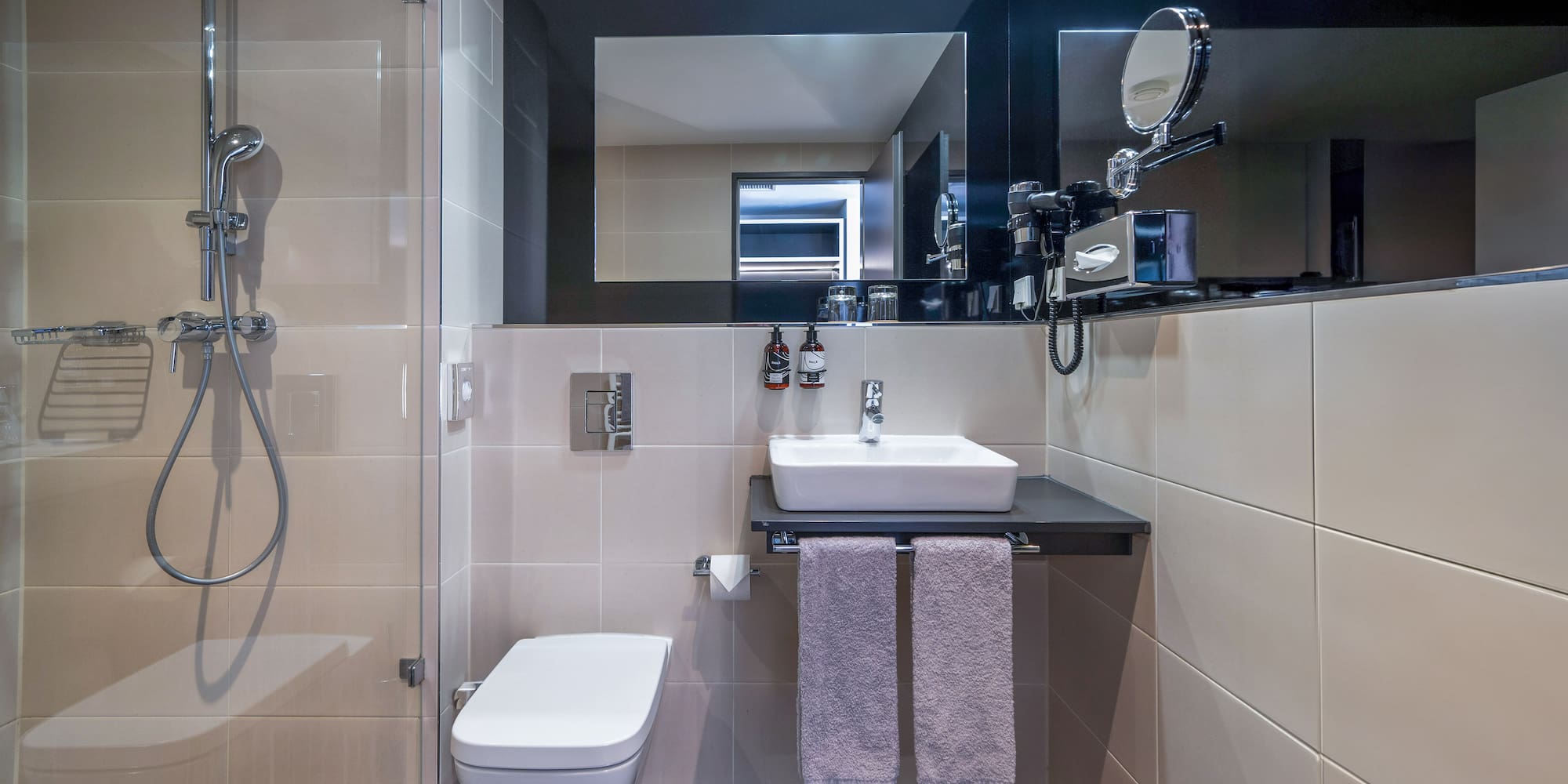 a bathroom with a sink and shower