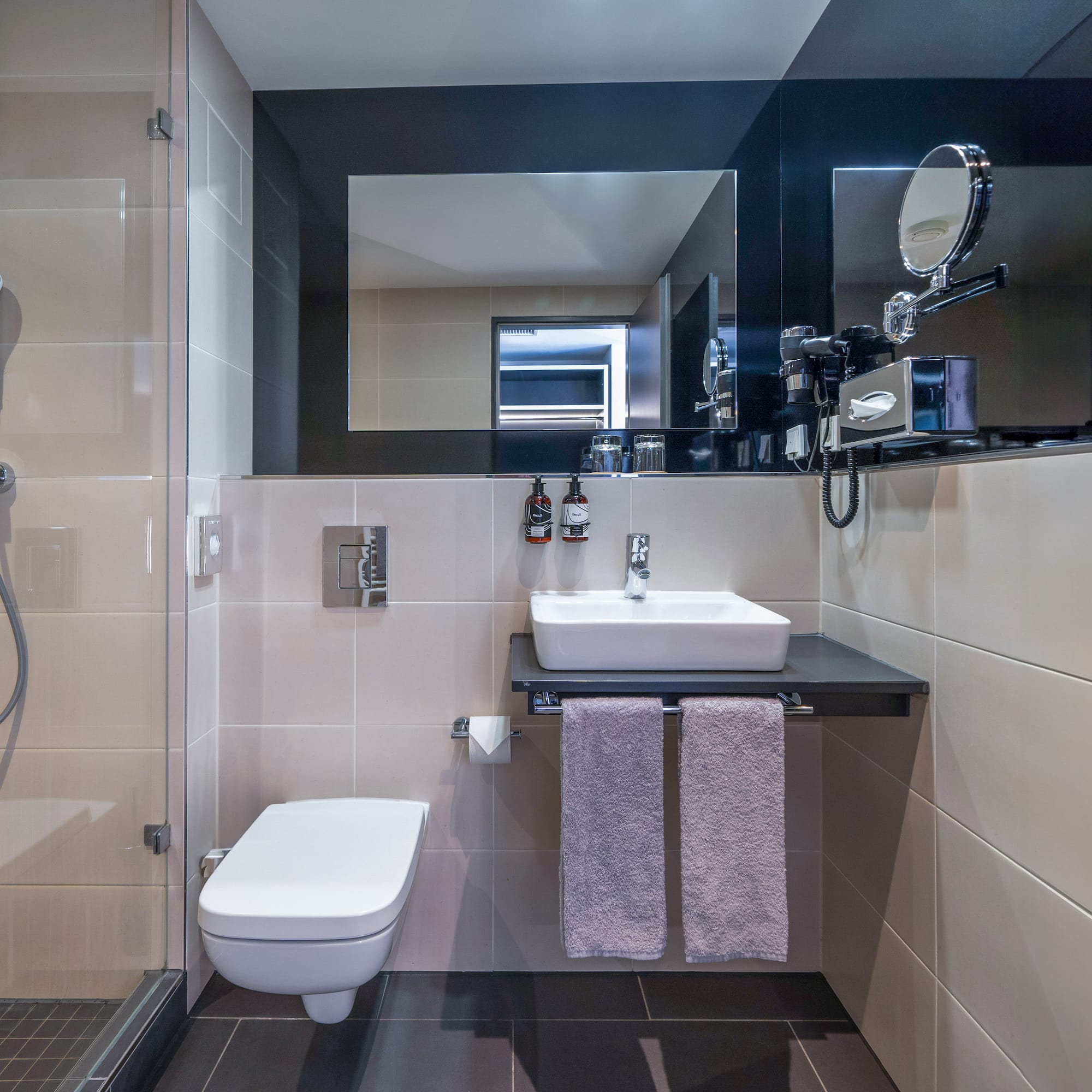 a bathroom with a sink and shower