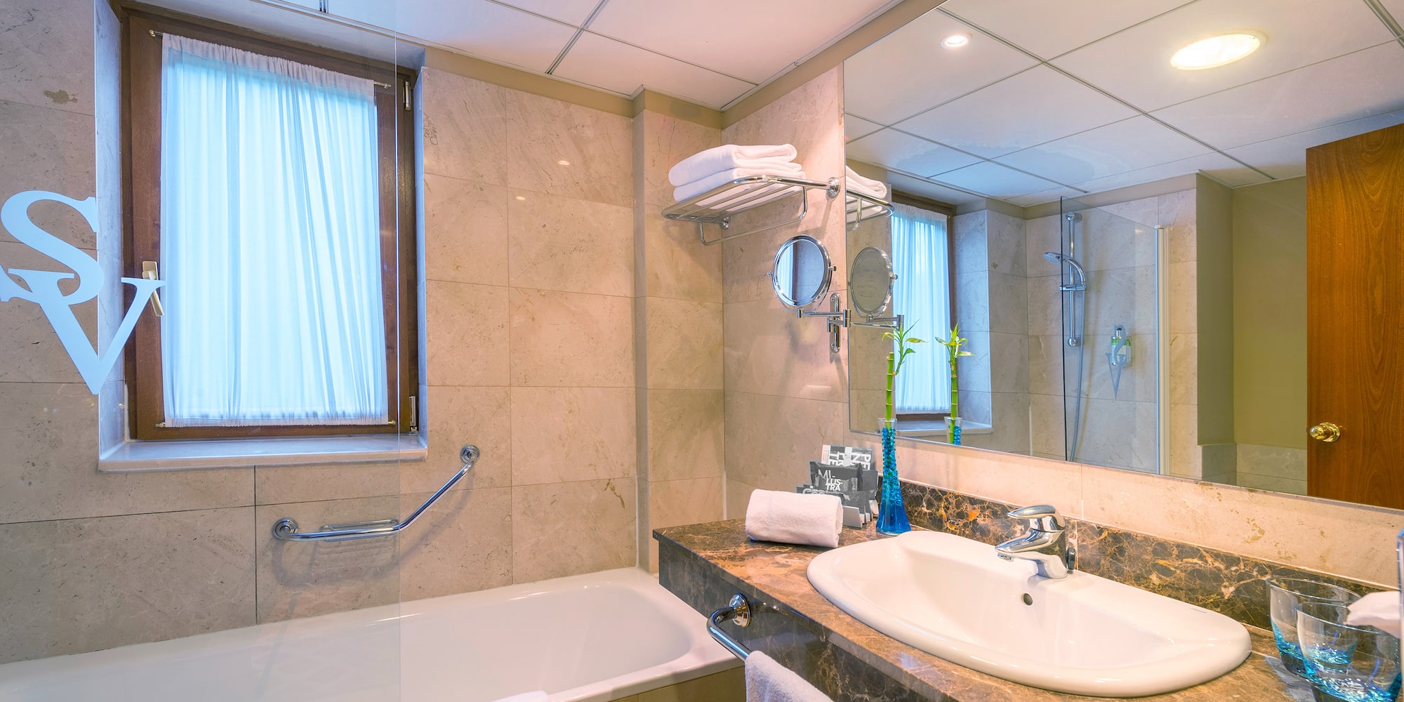 a bathroom with a bathtub and sink