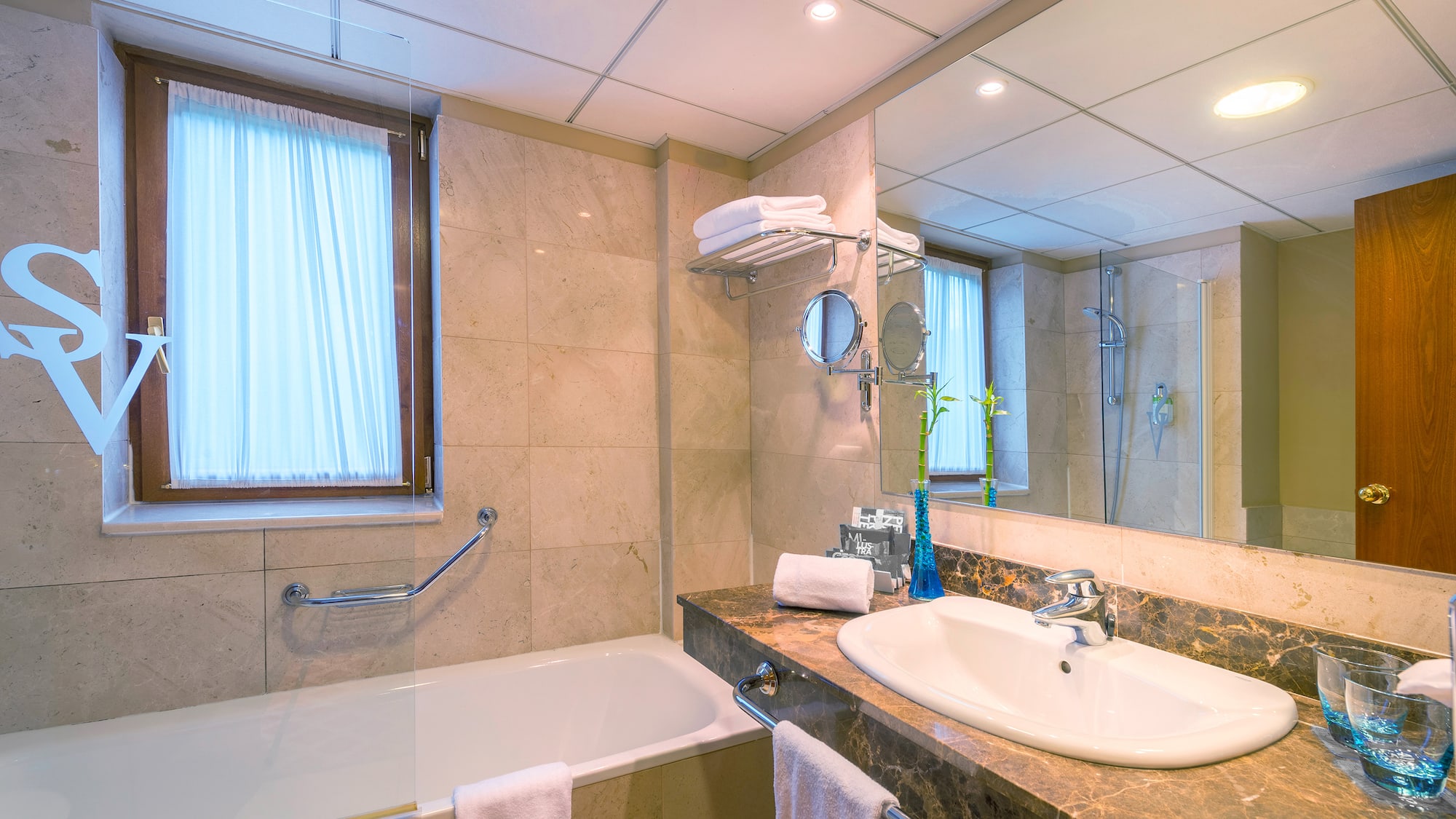 a bathroom with a bathtub and sink
