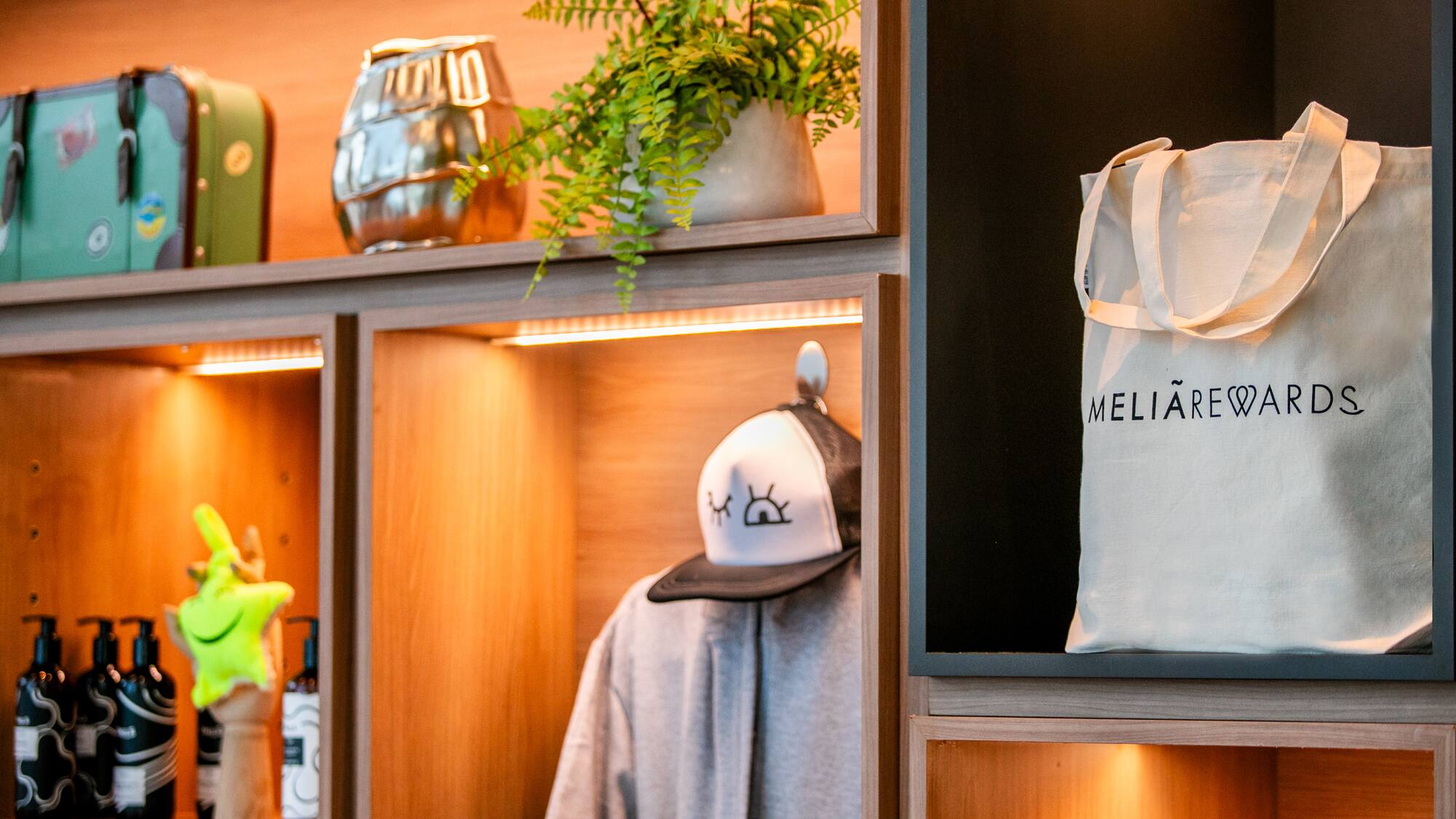 a shelf with a hat and a bag on it