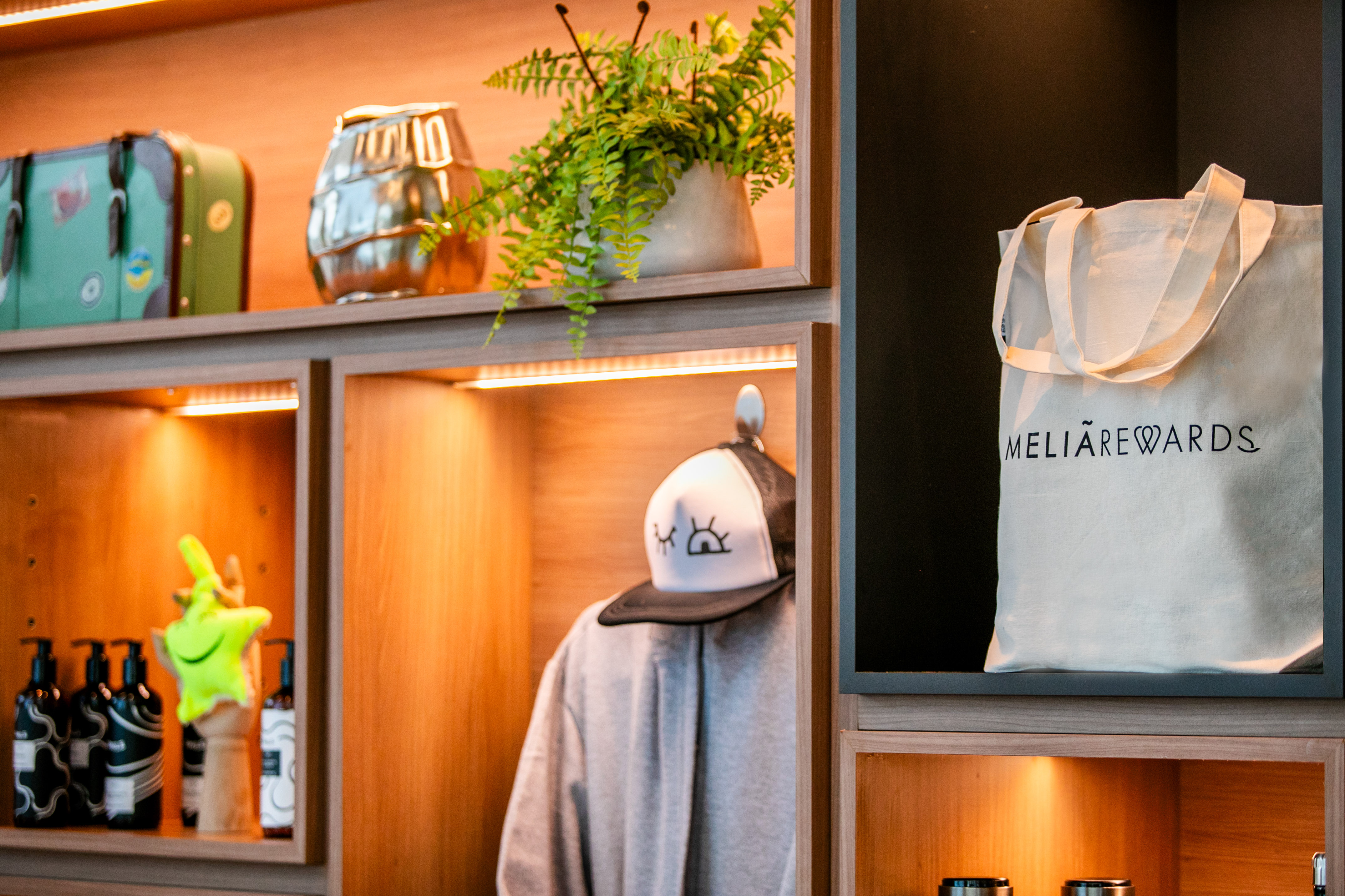 a shelf with a hat and a bag on it