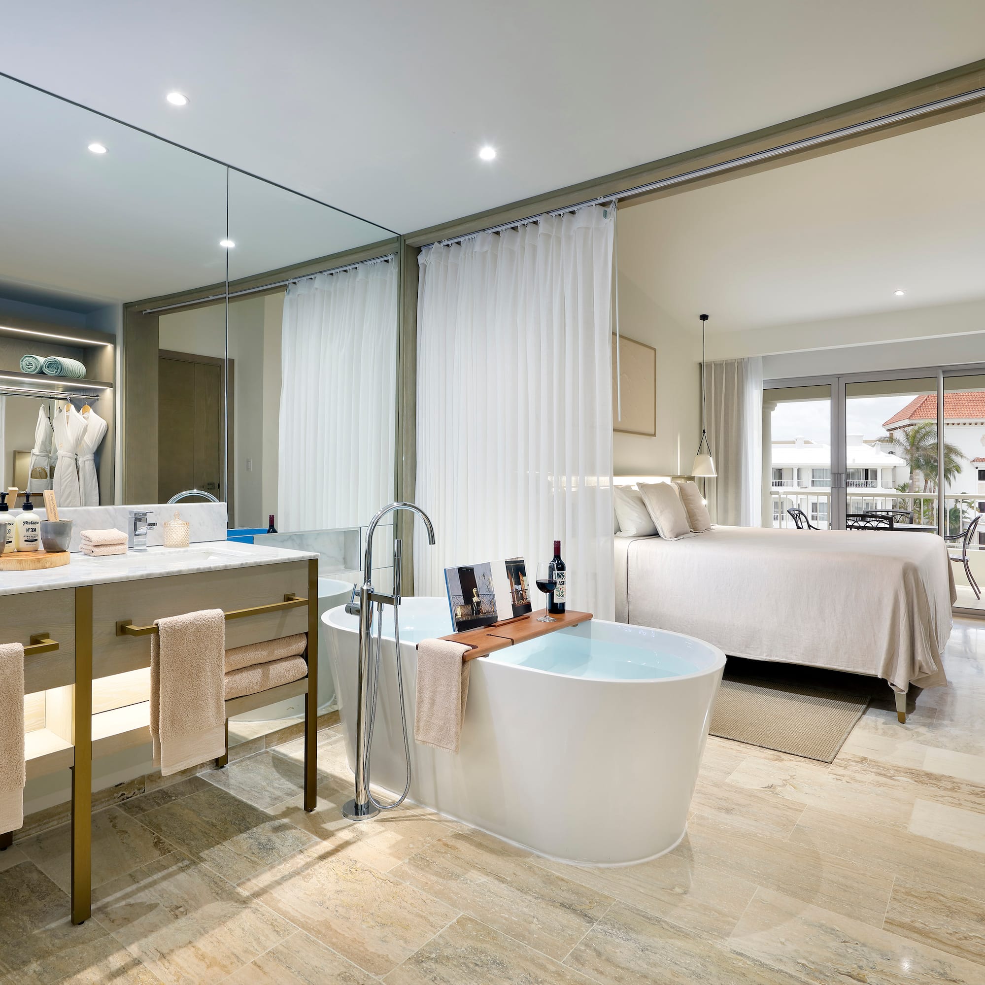 a bathroom with a tub and a bed