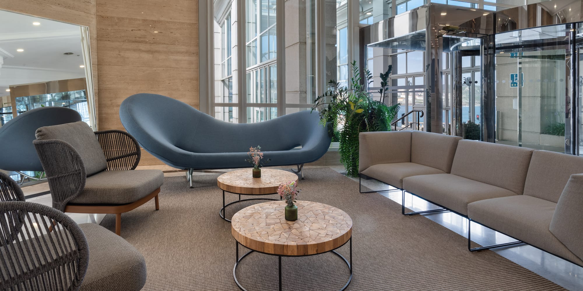 a room with a couch and chairs