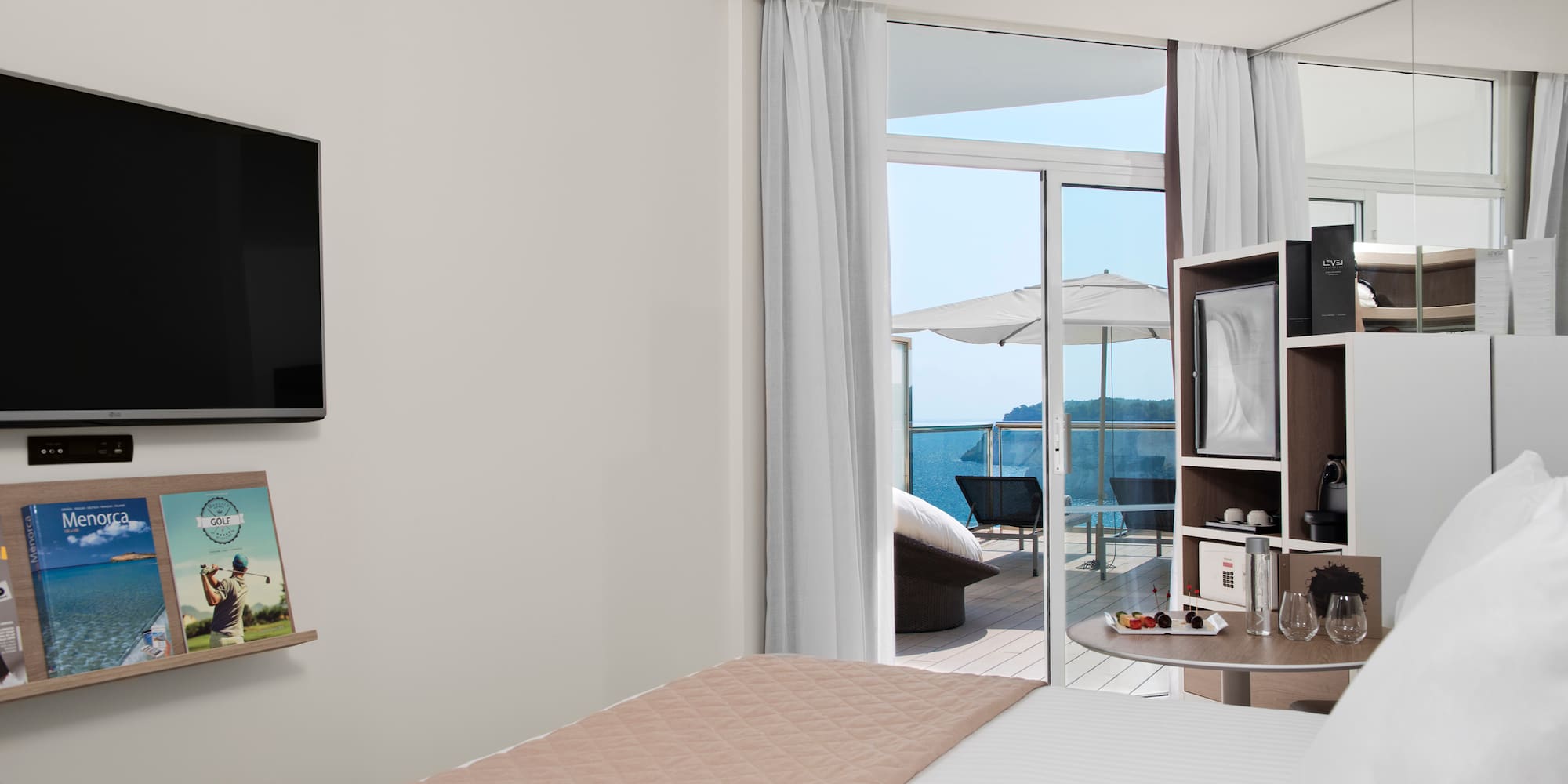 a room with a bed and a television