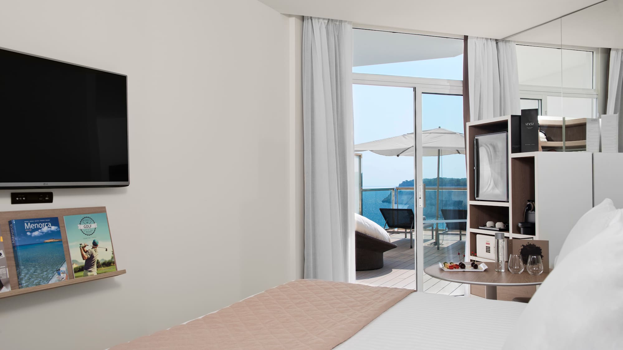 a room with a bed and a television