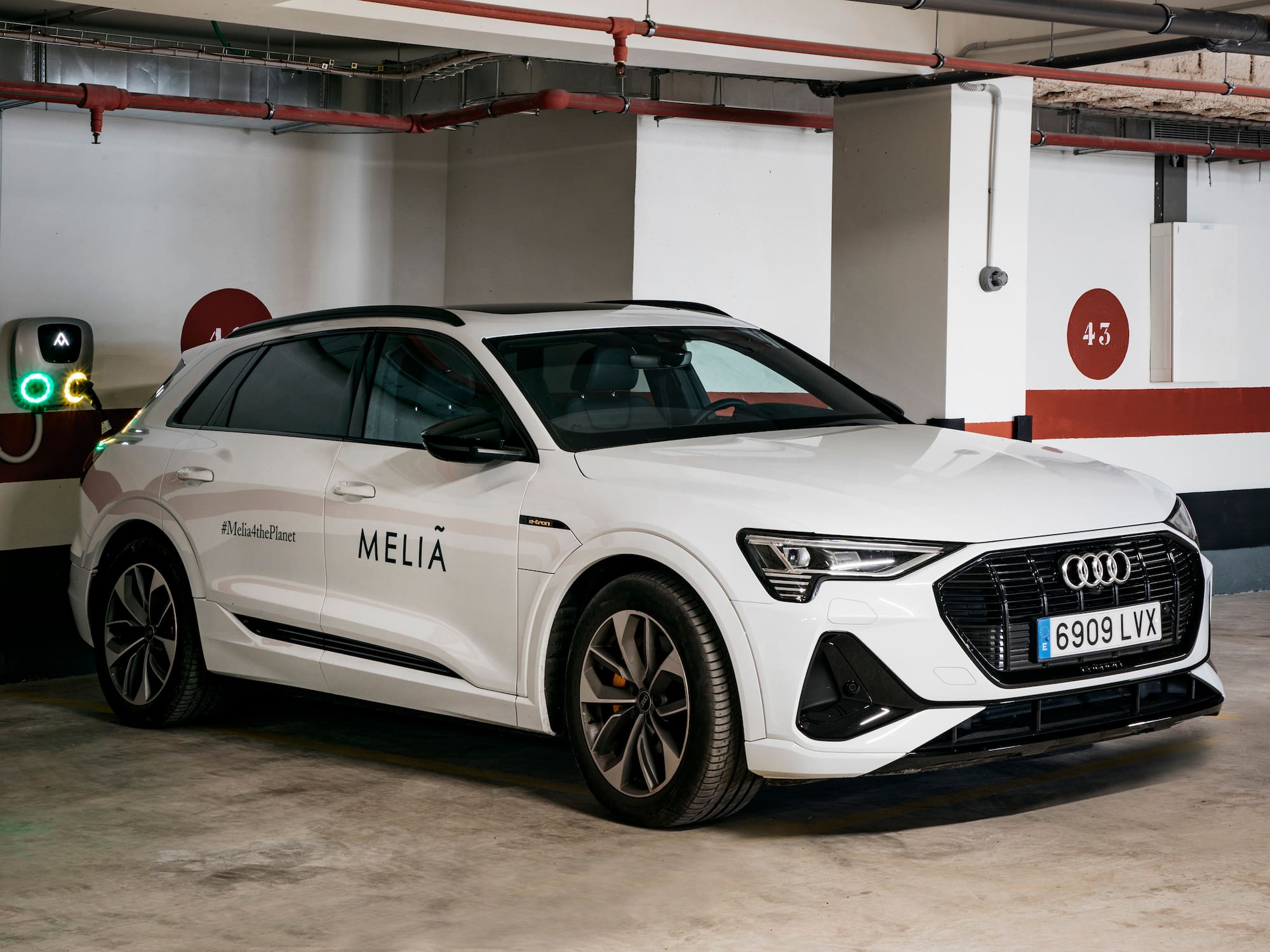 a white car parked in a parking lot