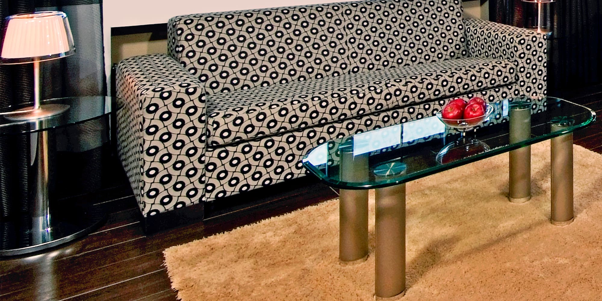 a couch and a glass coffee table