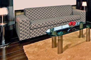 a couch and a glass coffee table