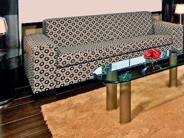 a couch and a glass coffee table
