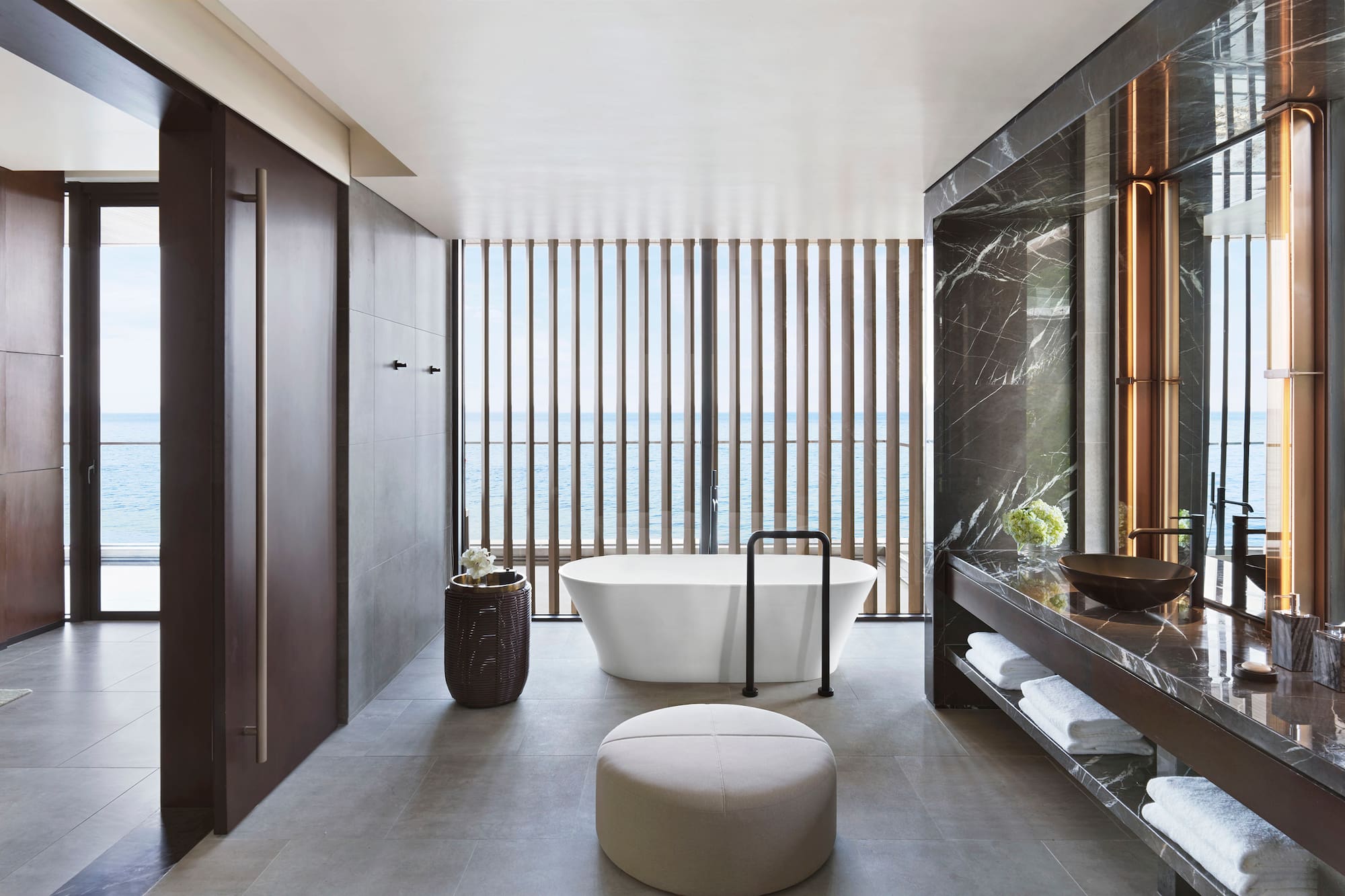 a bathroom with a tub and a sink