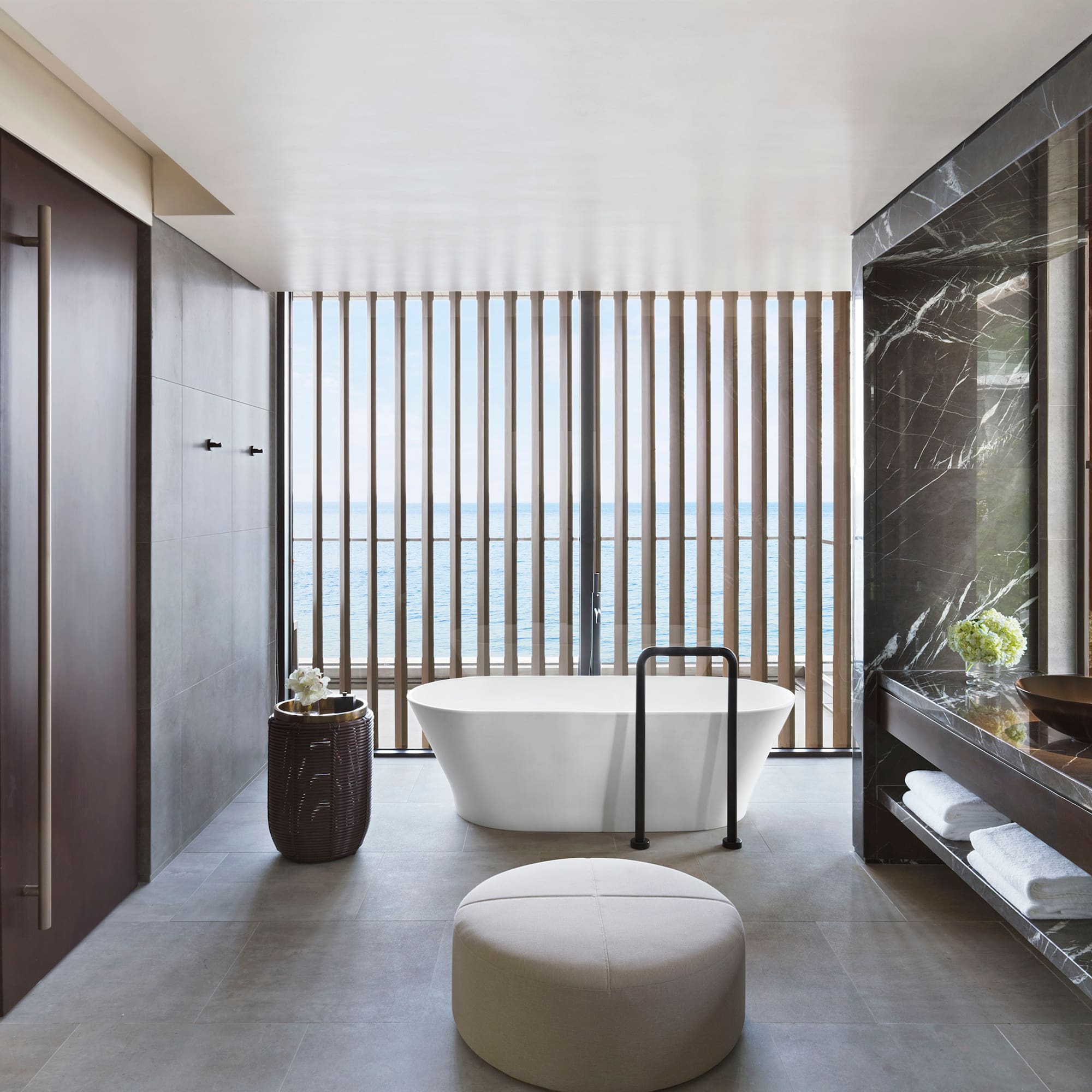 a bathroom with a tub and a sink