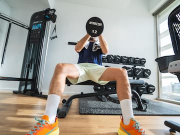 a man lifting a weight