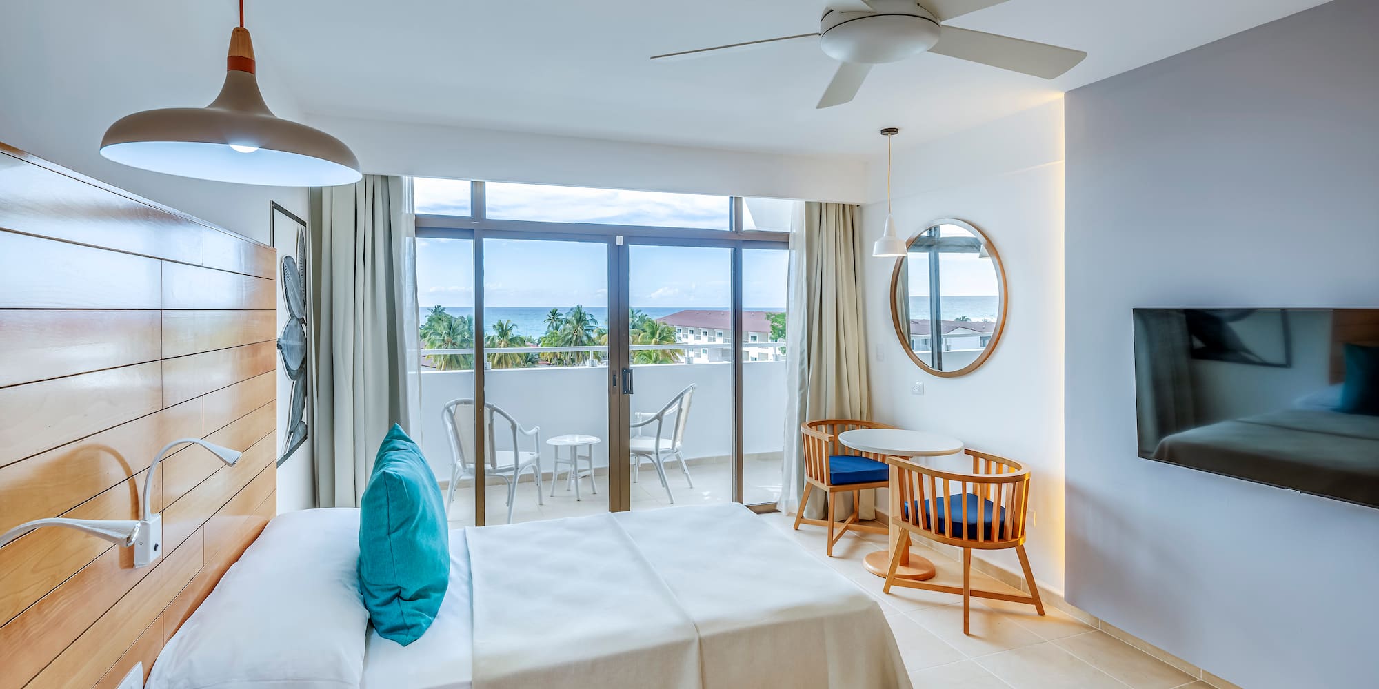 a room with a bed and a television