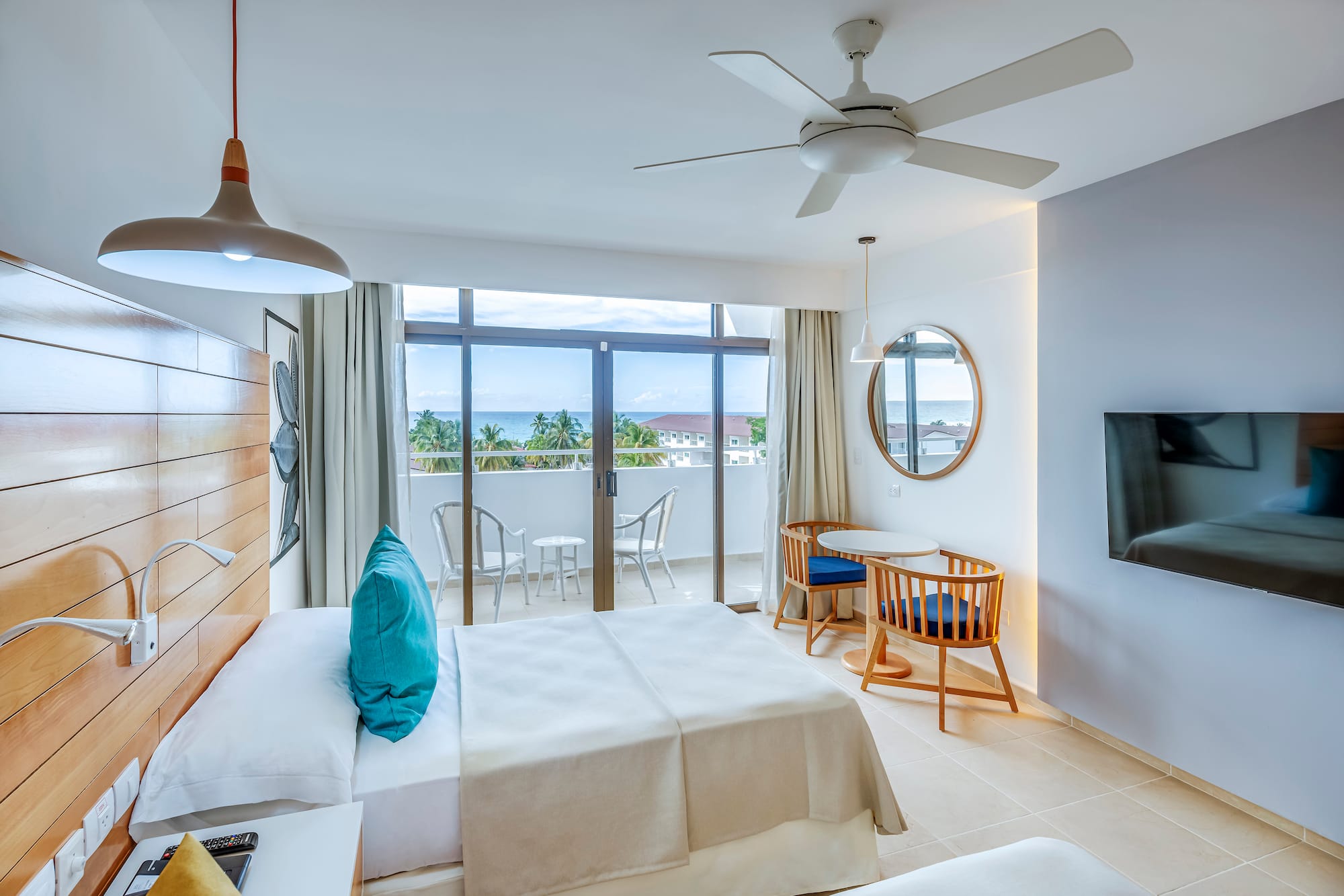 a room with a bed and a television