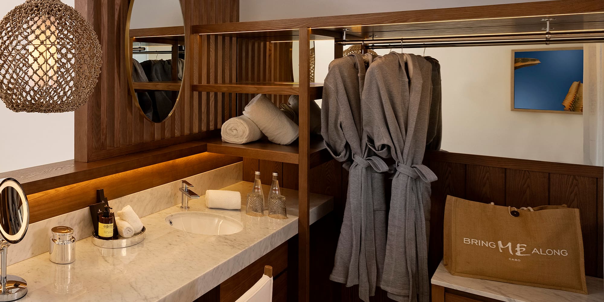 a bathroom with a mirror and towels