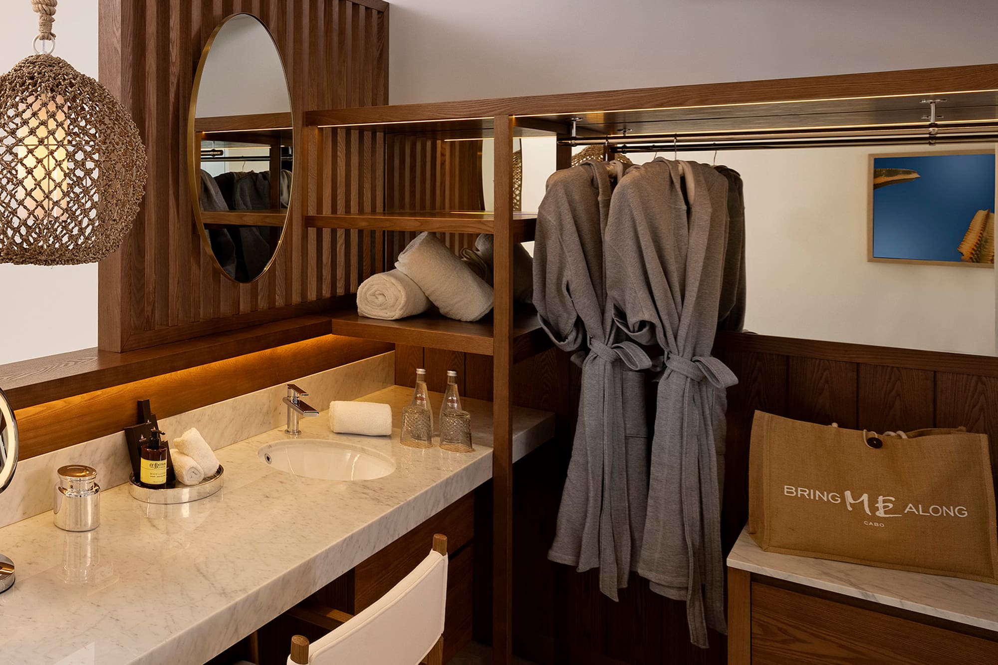 a bathroom with a mirror and towels