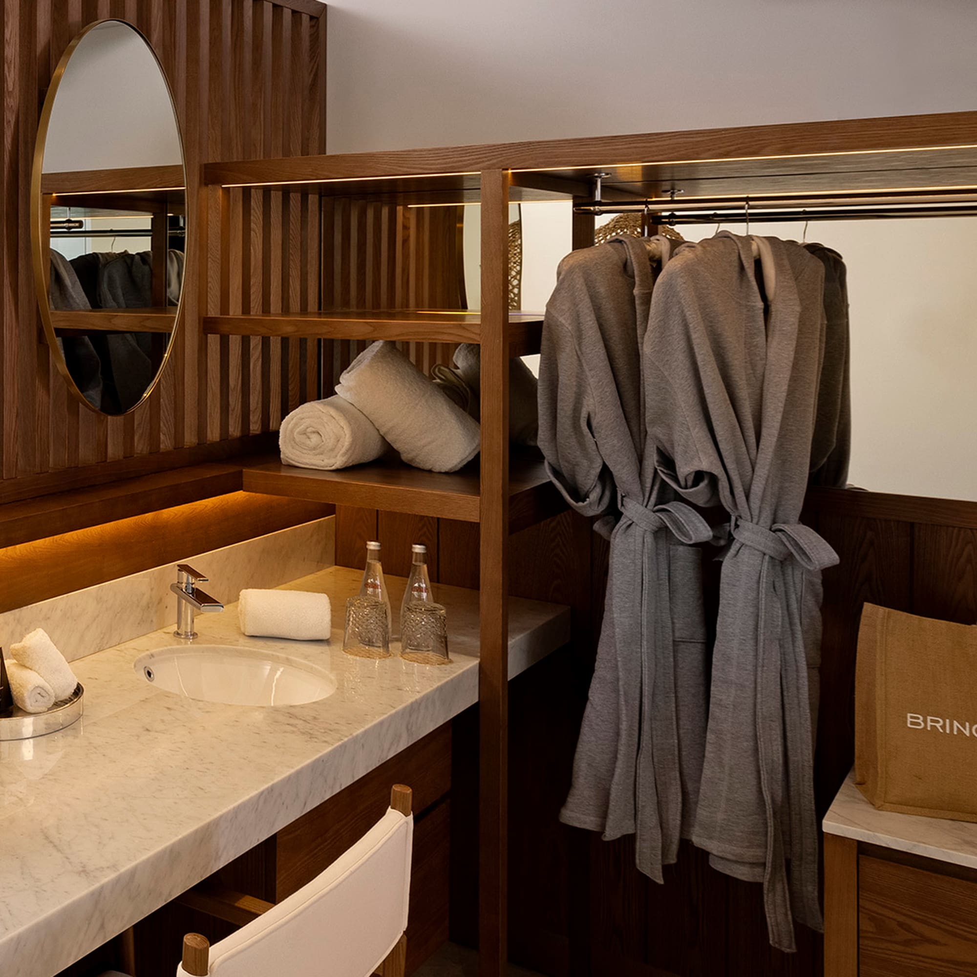 a bathroom with a mirror and towels