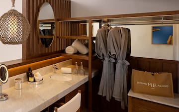 a bathroom with a mirror and towels