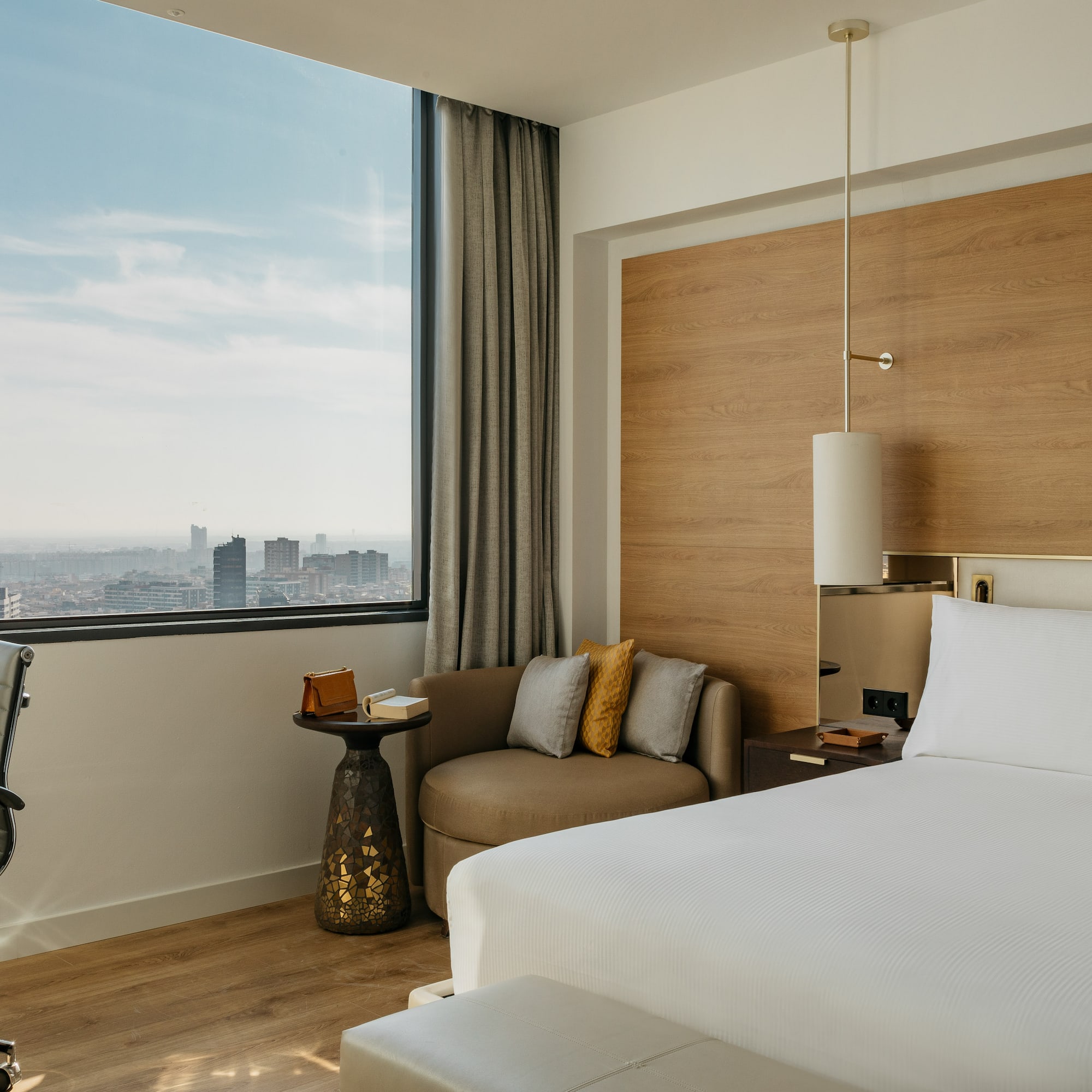 a living room with a couch and a lamp