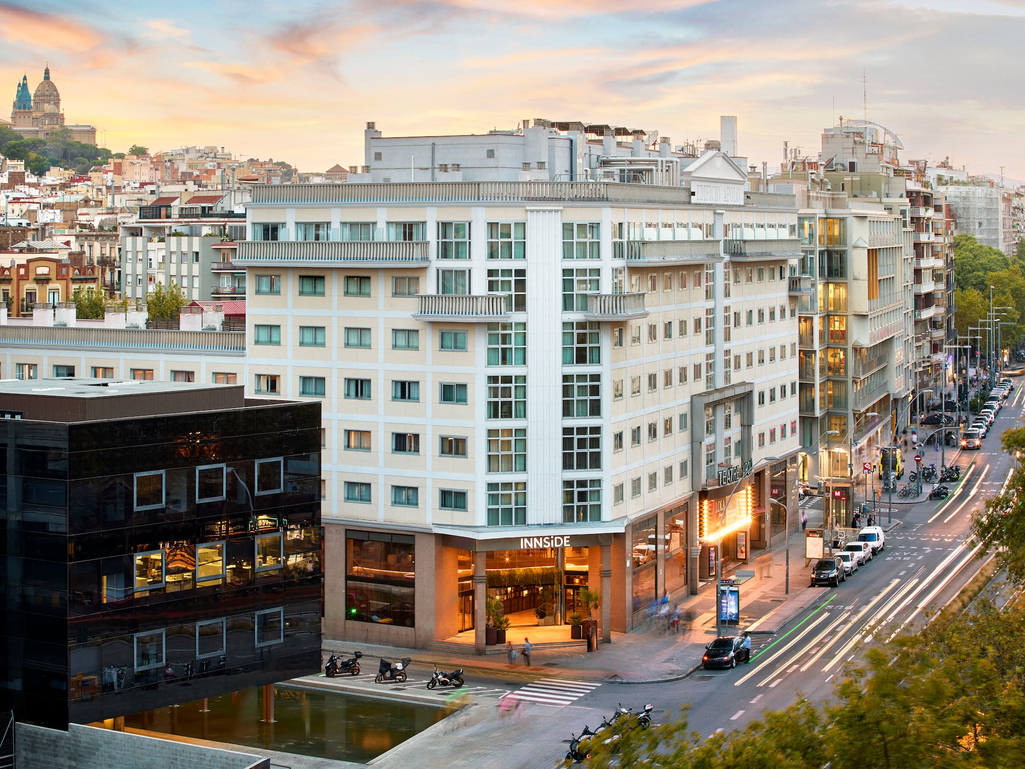 a city street with buildings and cars