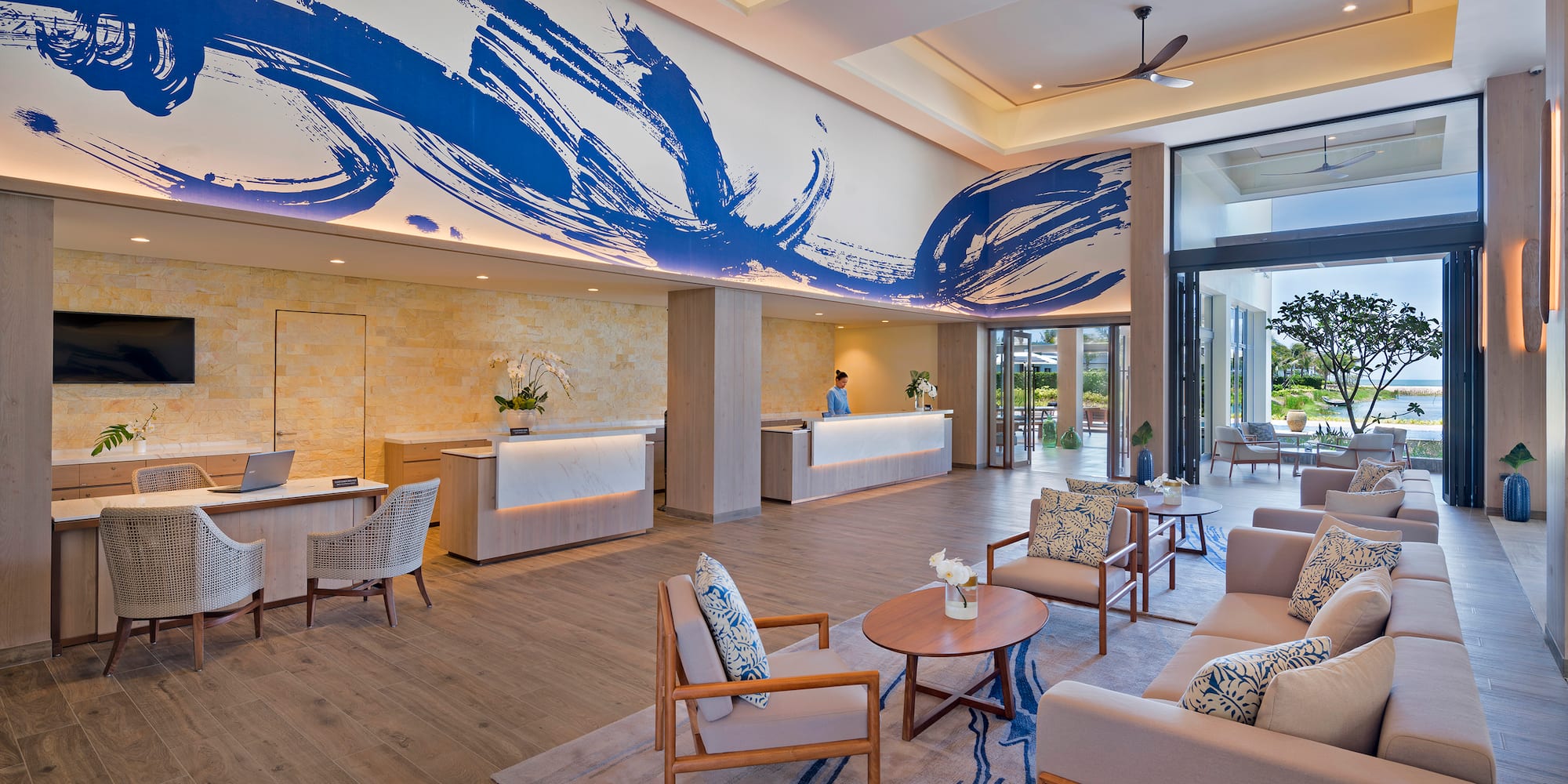 a lobby with a reception desk and chairs