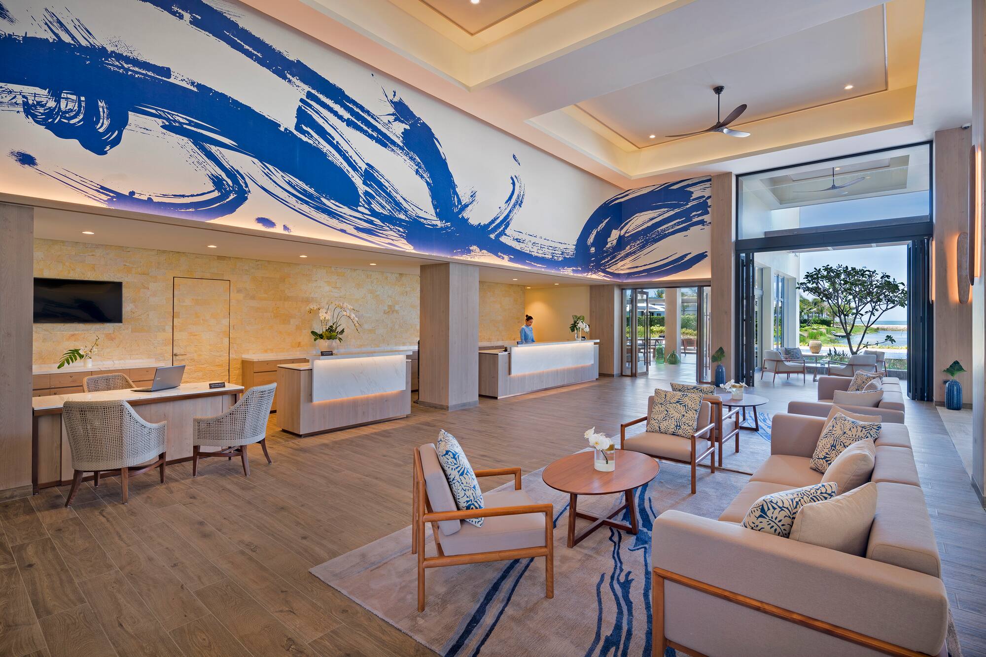 a lobby with a reception desk and chairs
