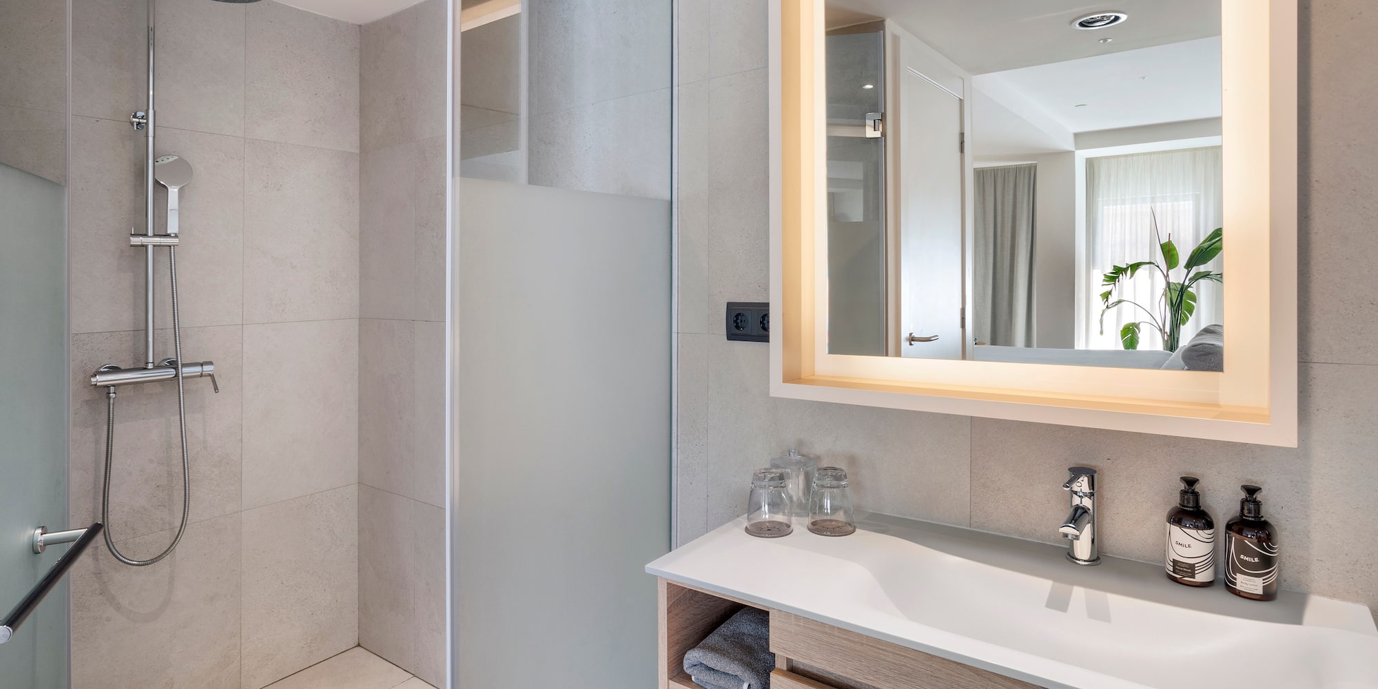 a bathroom with a mirror and sink