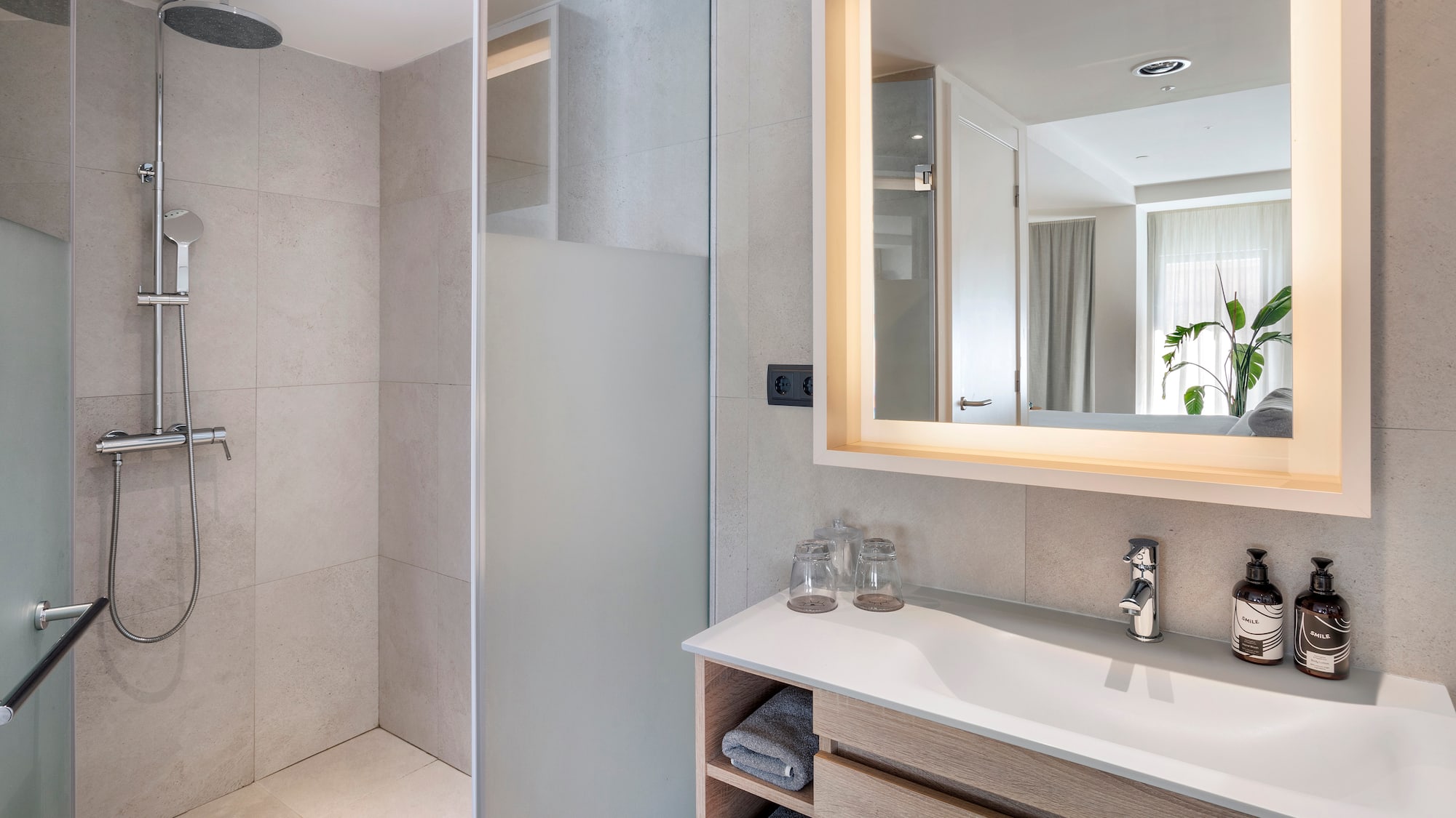 a bathroom with a mirror and sink