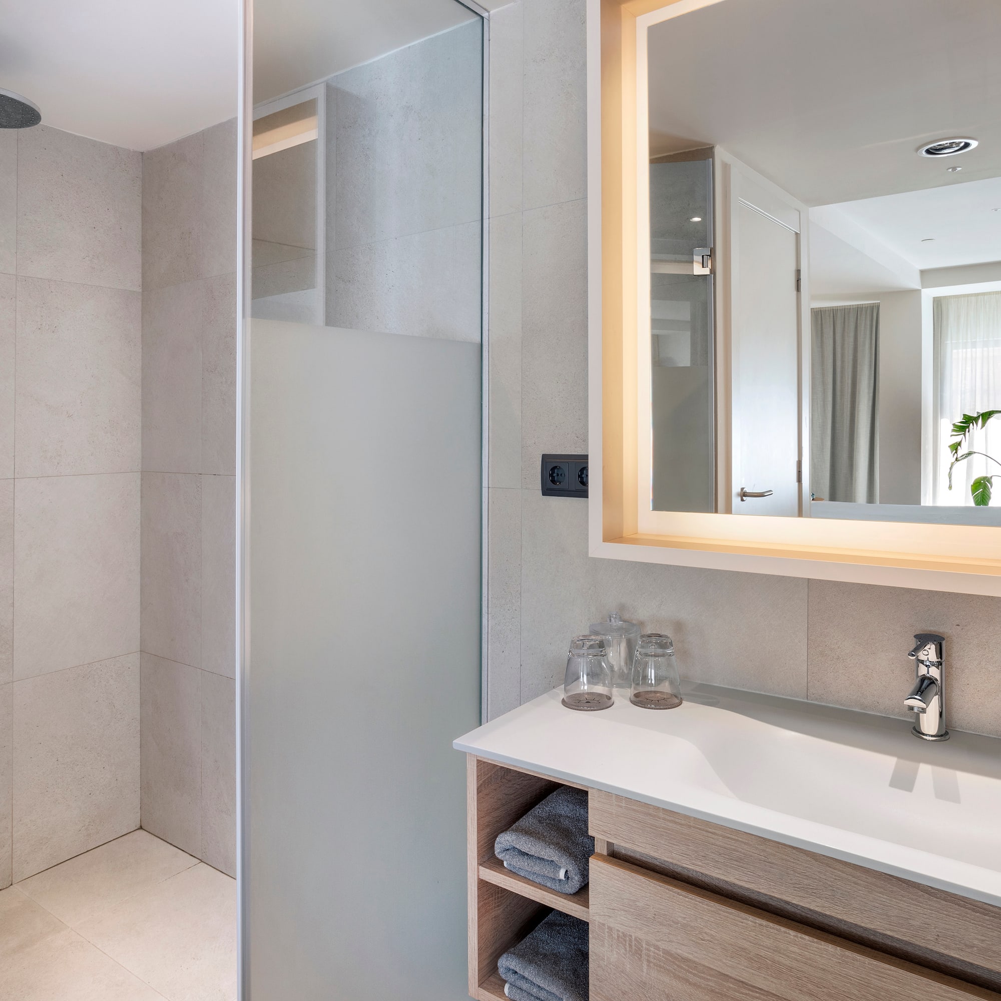 a bathroom with a mirror and sink