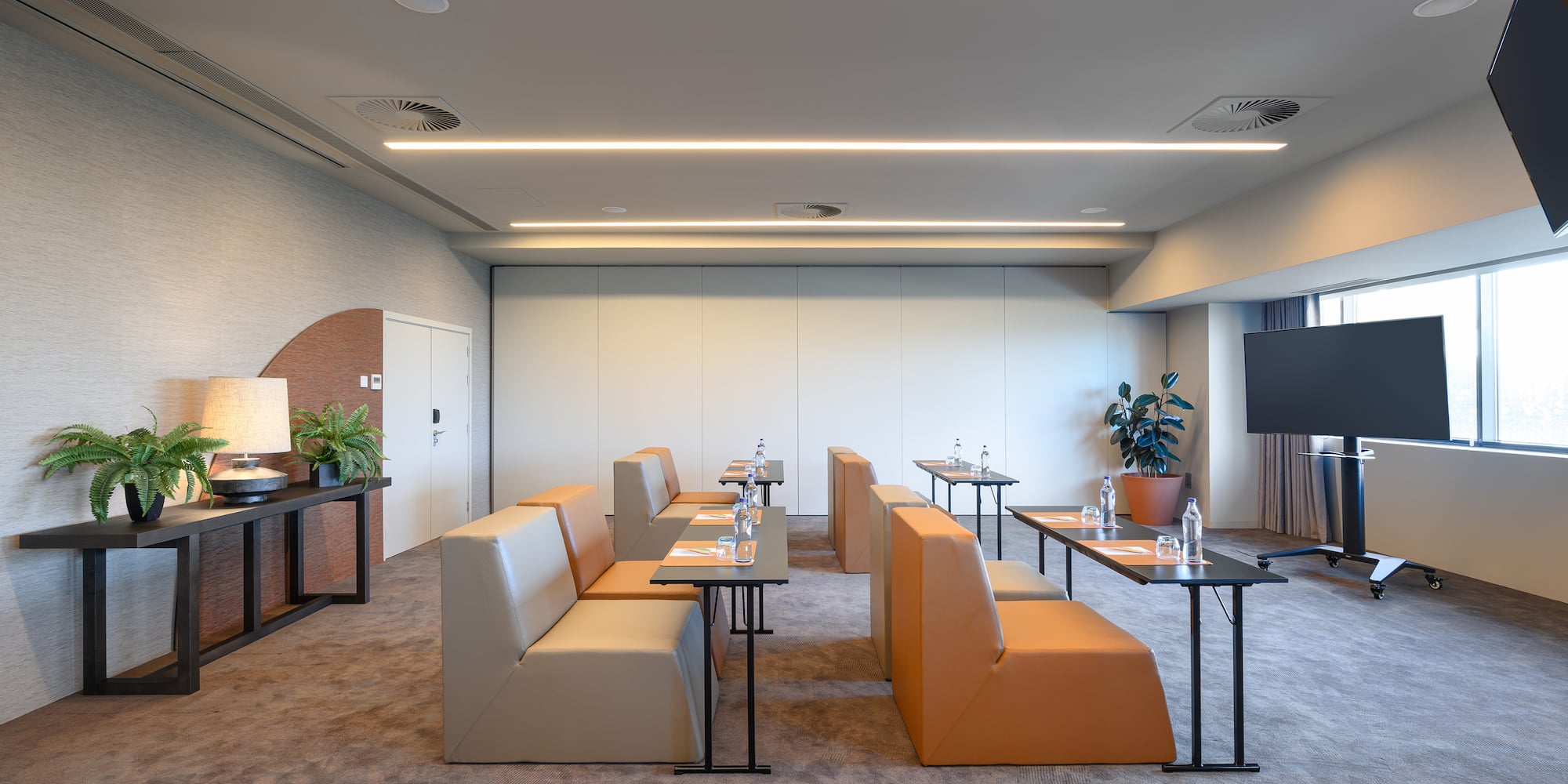 a room with couches and tables