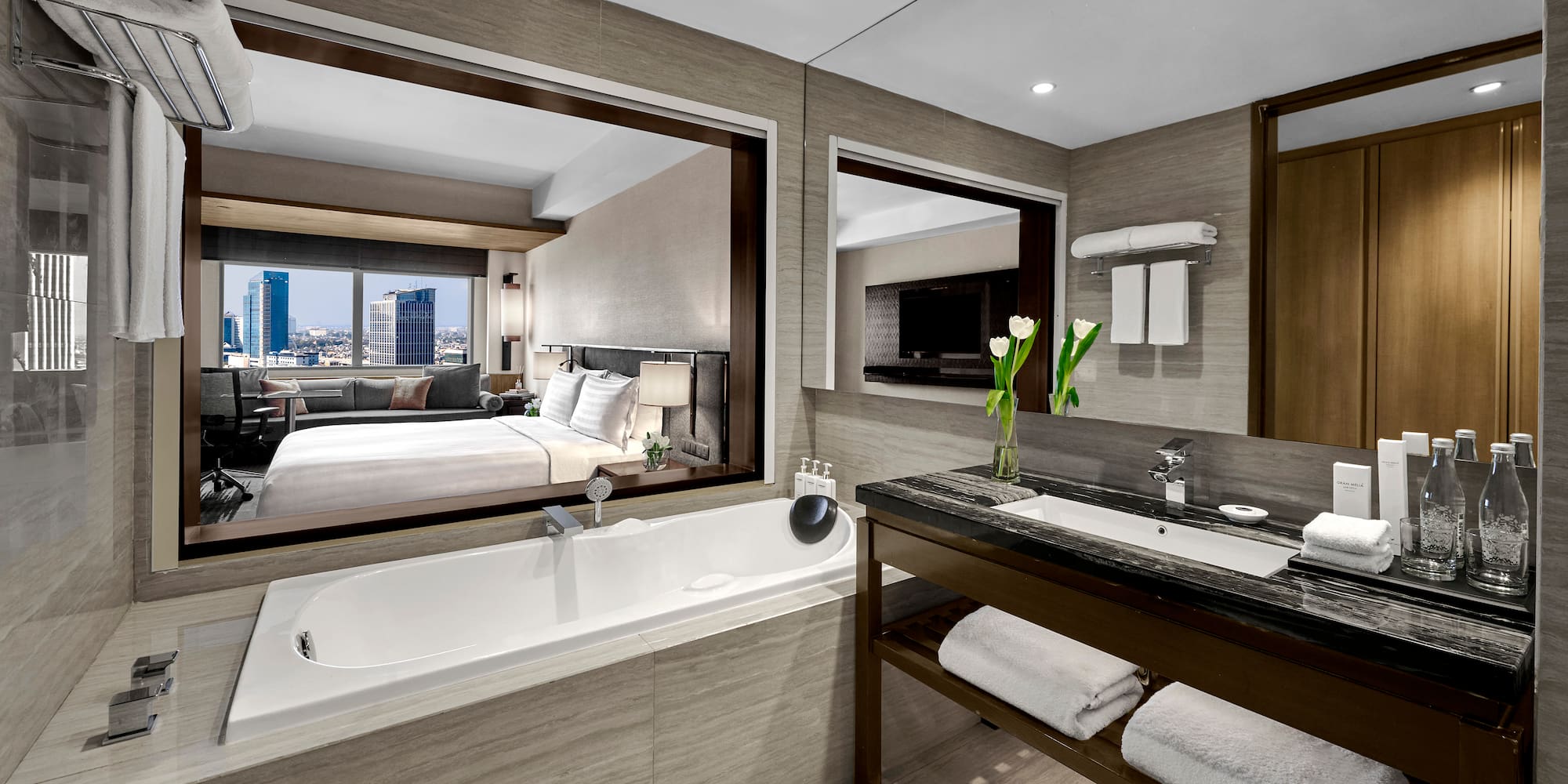 a bathroom with a bathtub and a mirror