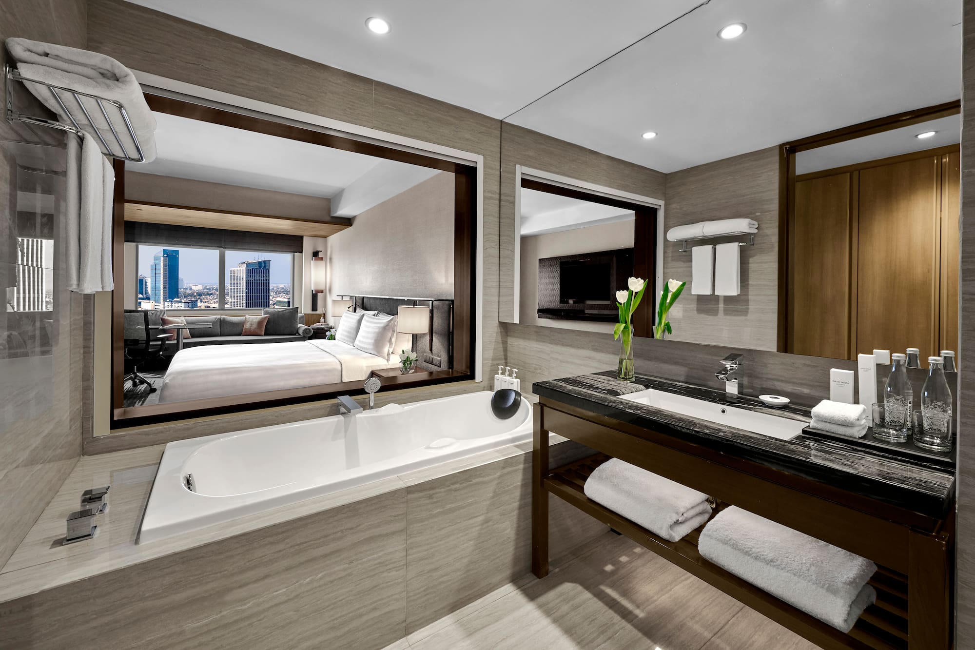 a bathroom with a bathtub and a mirror
