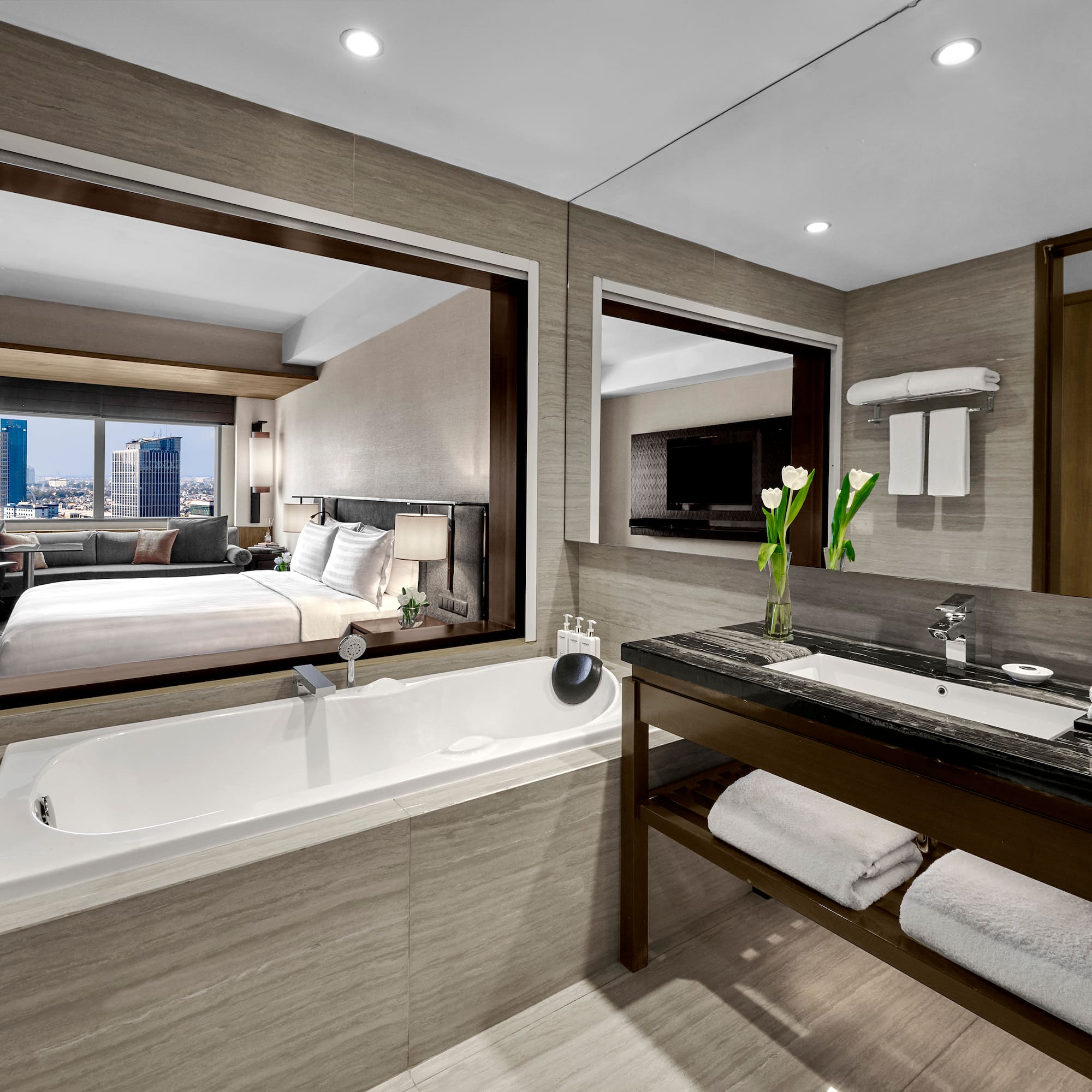 a bathroom with a bathtub and a mirror