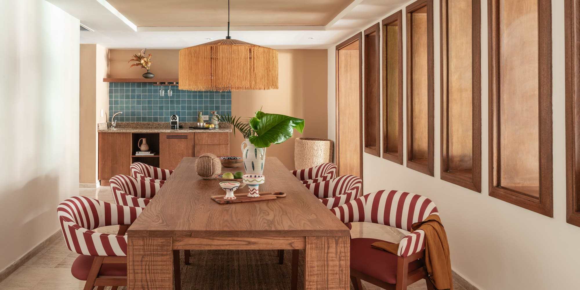 a dining room with a table and chairs
