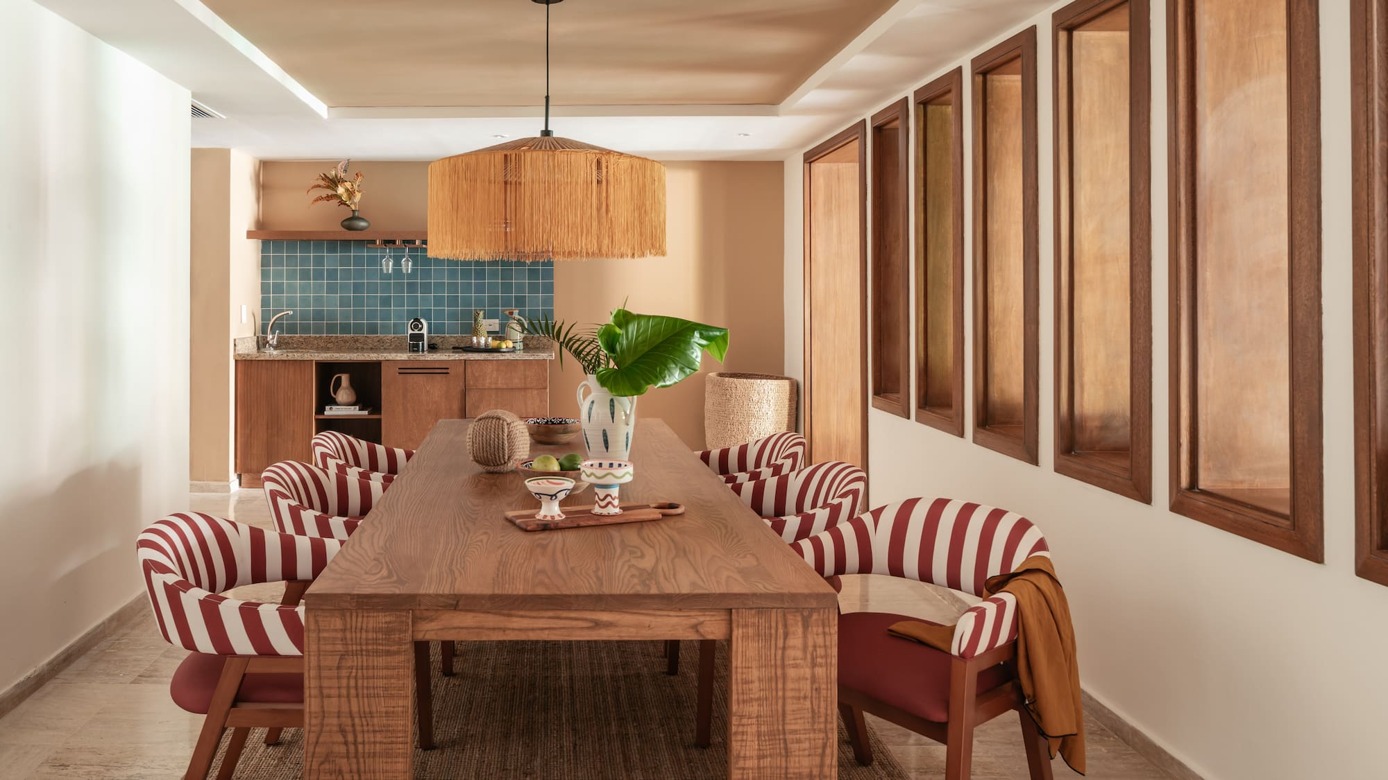 a dining room with a table and chairs