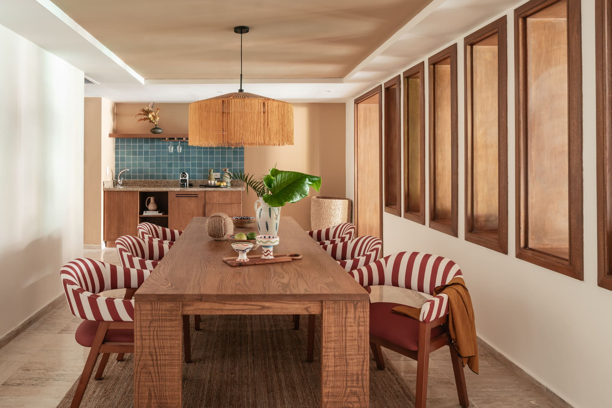 a dining room with a table and chairs