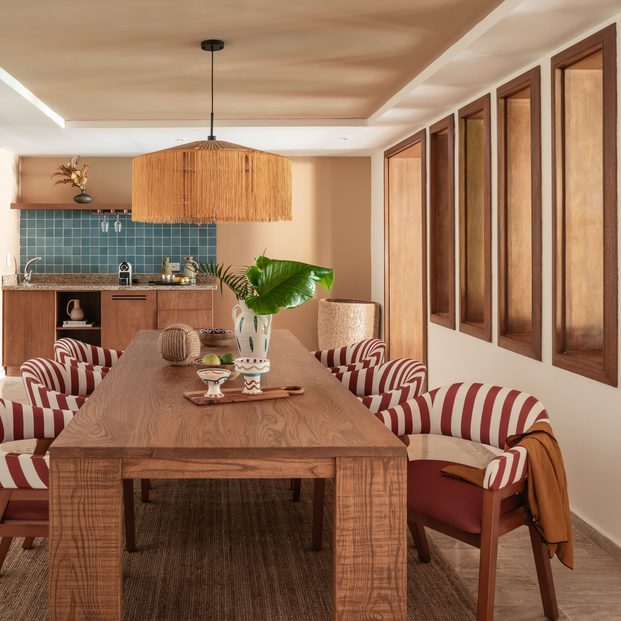 a dining room with a table and chairs