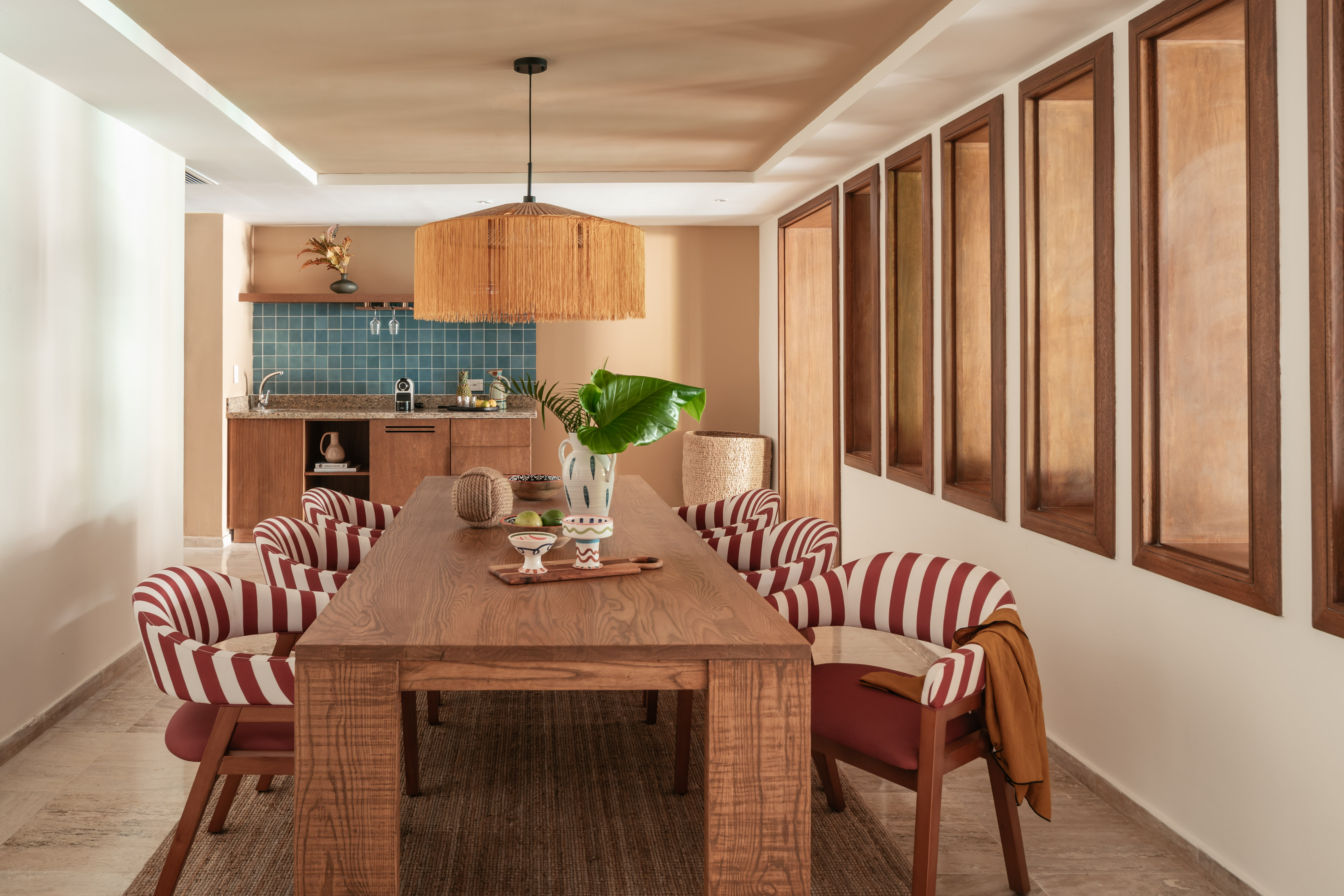 a dining room with a table and chairs